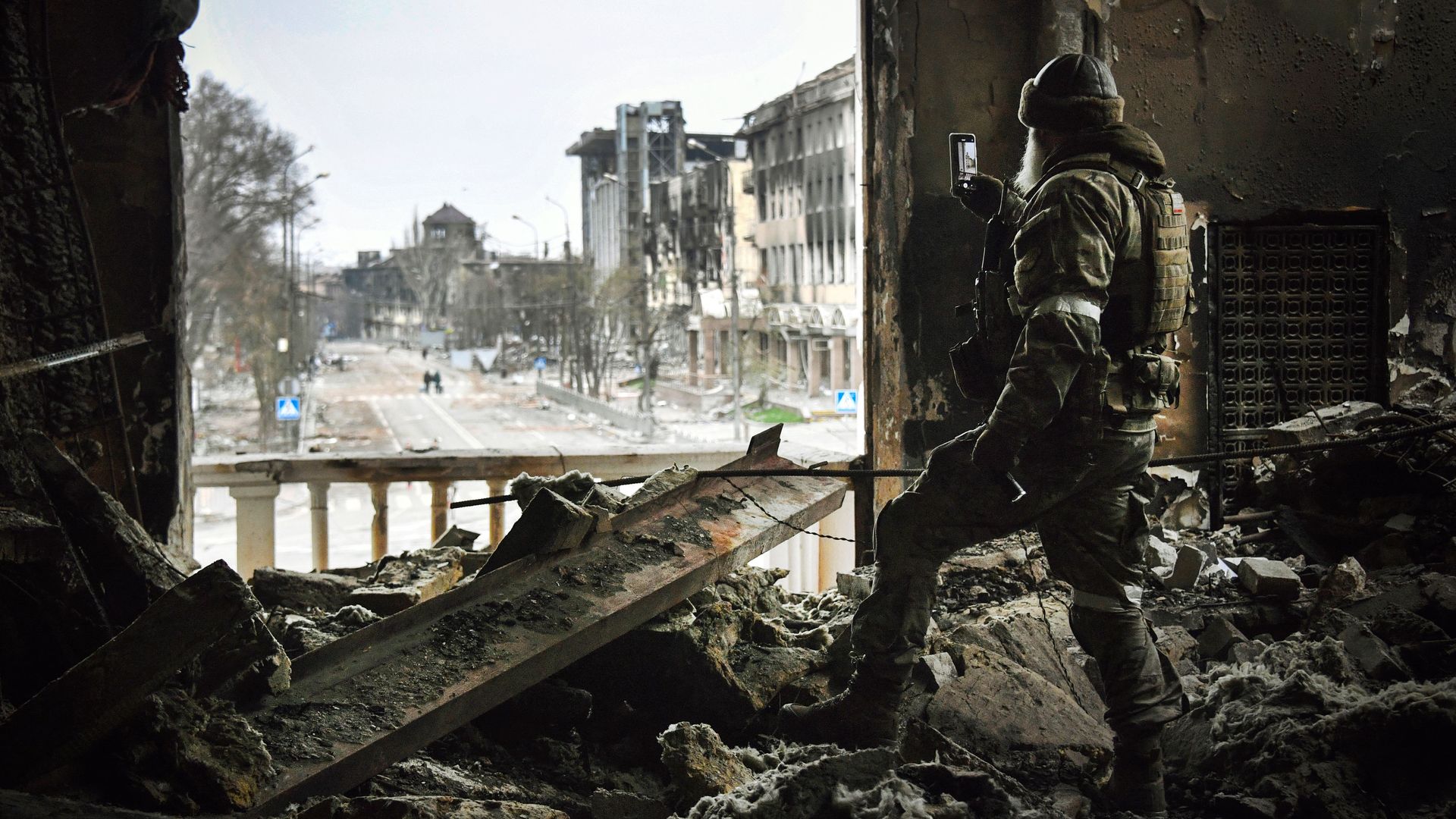 A Russian soldier patrols at the Mariupol drama theatre, bombed last March 16, on April 12, 2022 in Mariupol.