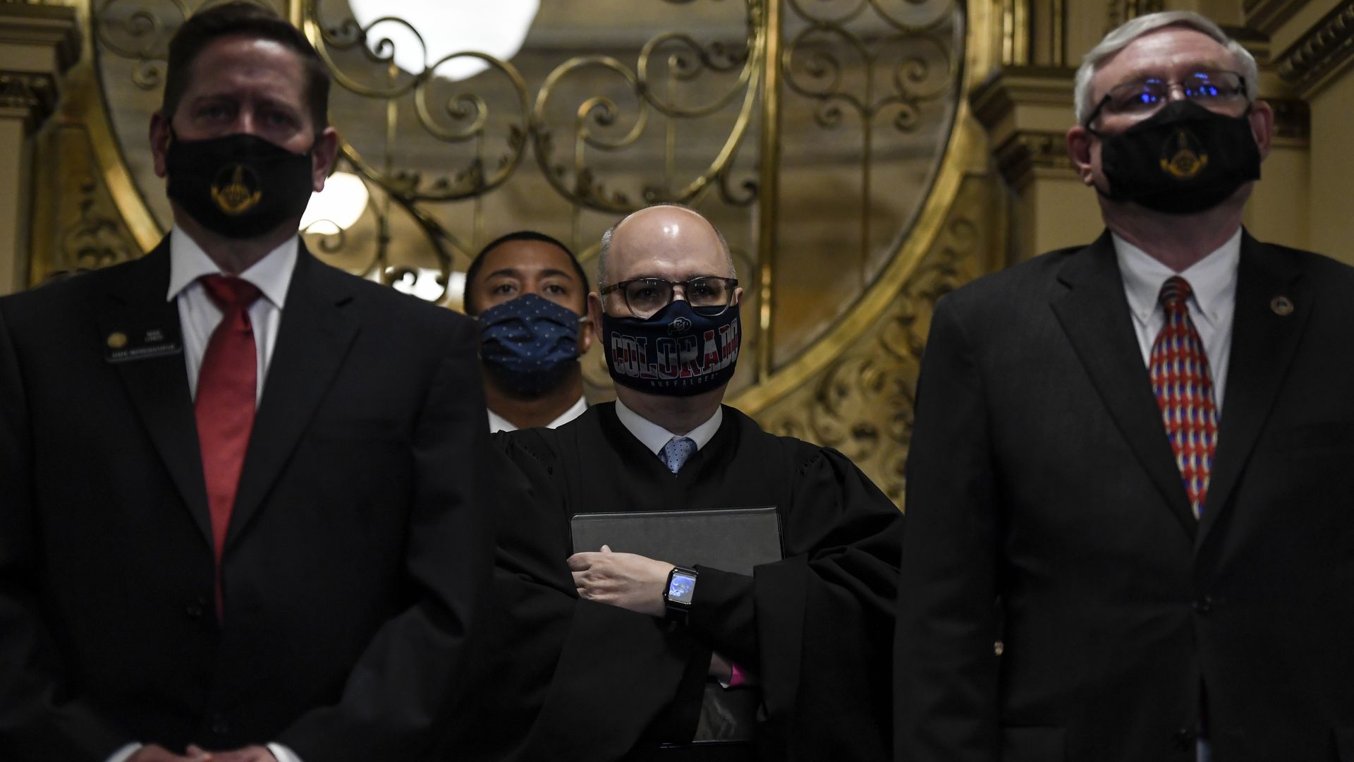 Colorado Supreme Court Chief Justice Brian D. Boatright, center, ahead of an address at the state Capitol in February.