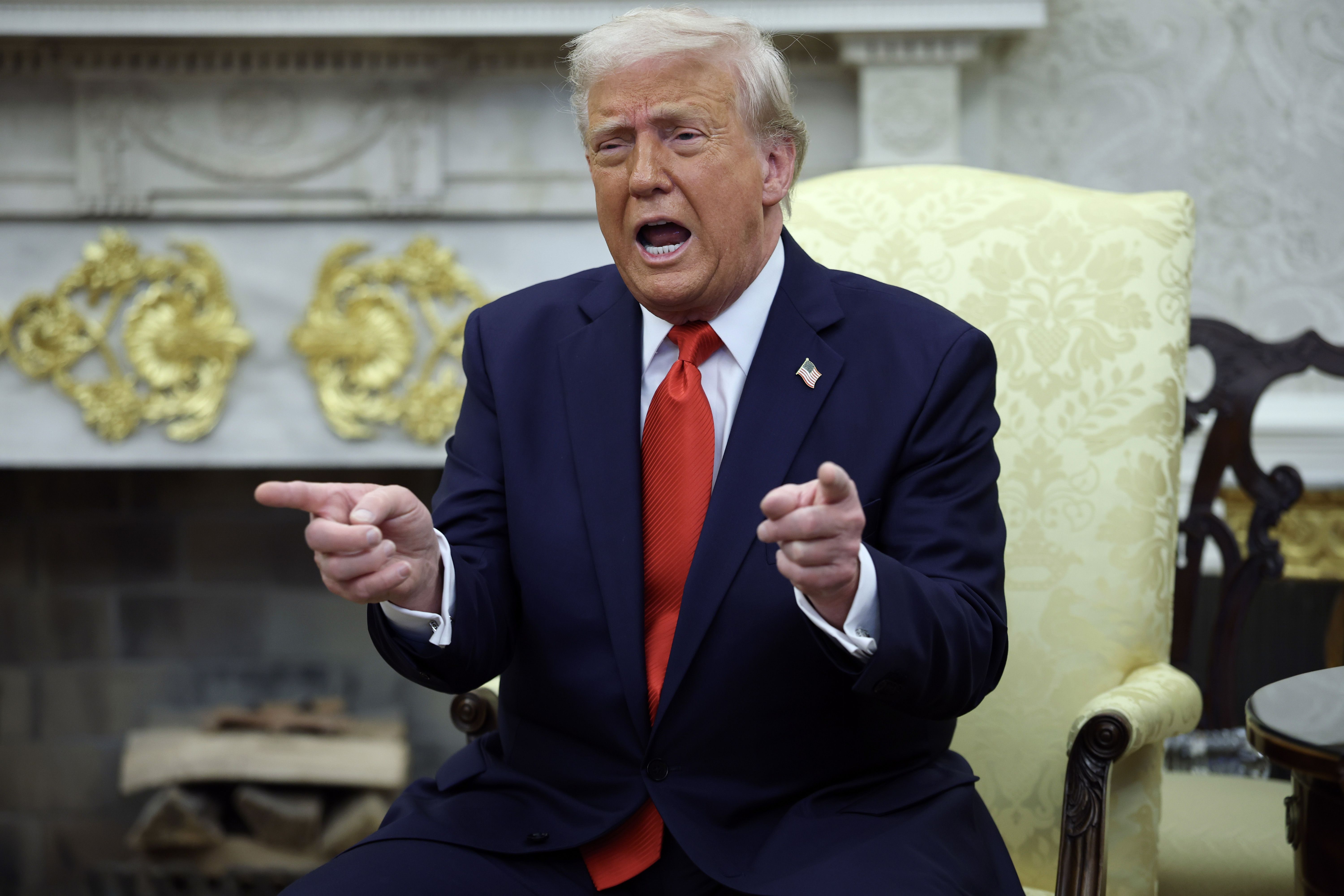 President Trump gestures during an Oval Office meeting with El Salvador President Nayib Bukele yesterday.
