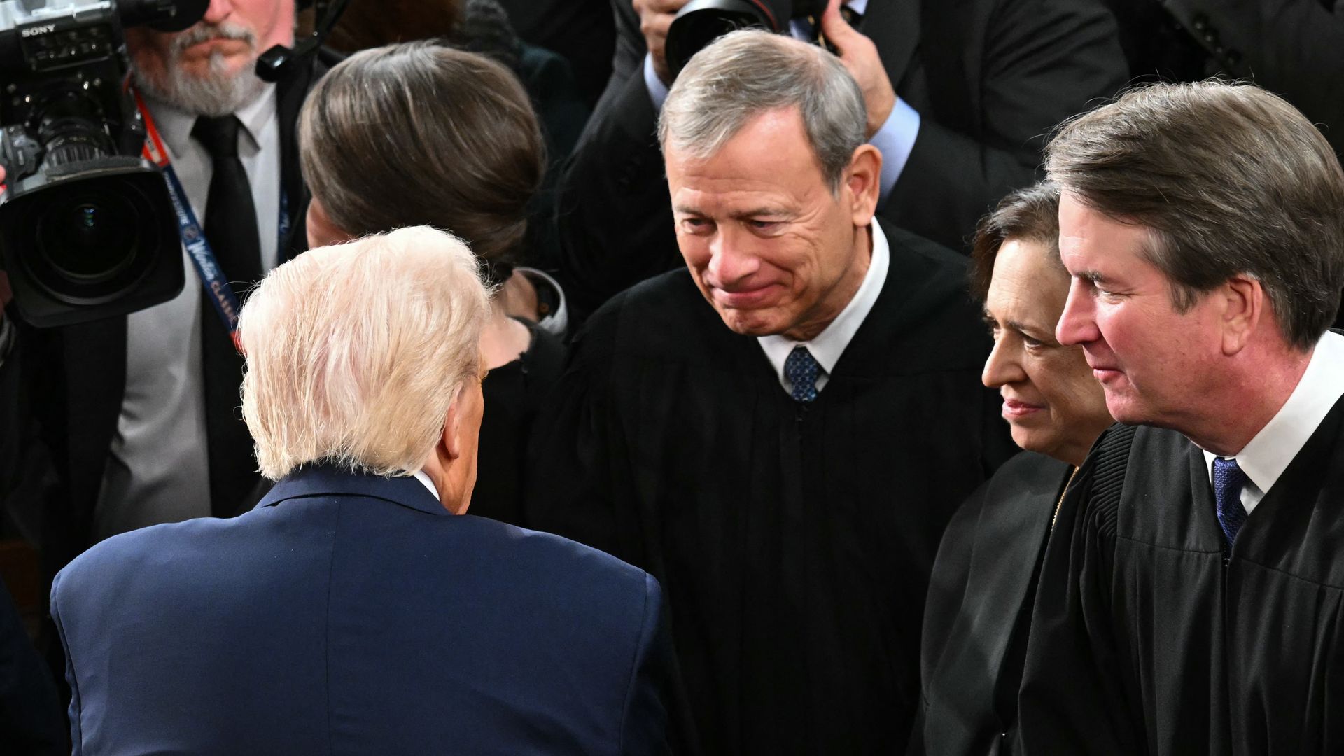 Chief Justice Roberts speaks to Trump after the president delivered a speech to Congress.