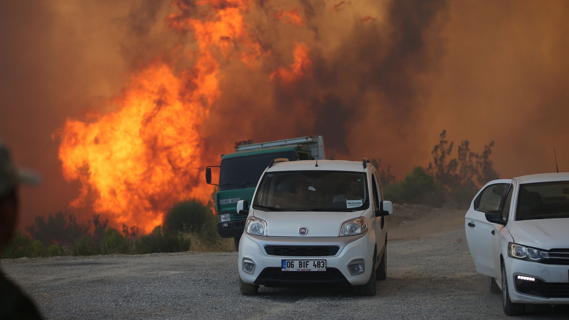 Smoke and flames rise as ground and air support works to extinguish the forest fire that broke out in Manavgat district continue in Antalya, Turkey on August 01, 2021.