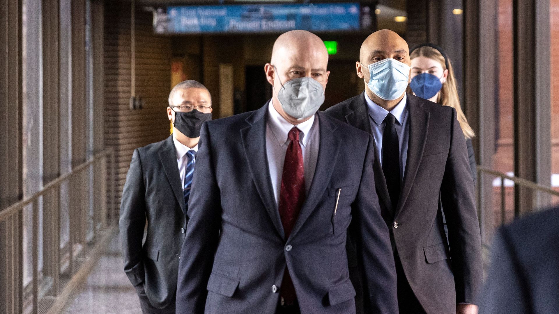 Former Minneapolis Police Officers J. Alexander Kueng (R) and Tou Thao (L) arrive with and attorney Thomas Plunkett (C) at the US District Court in St. Paul, Minnesota,