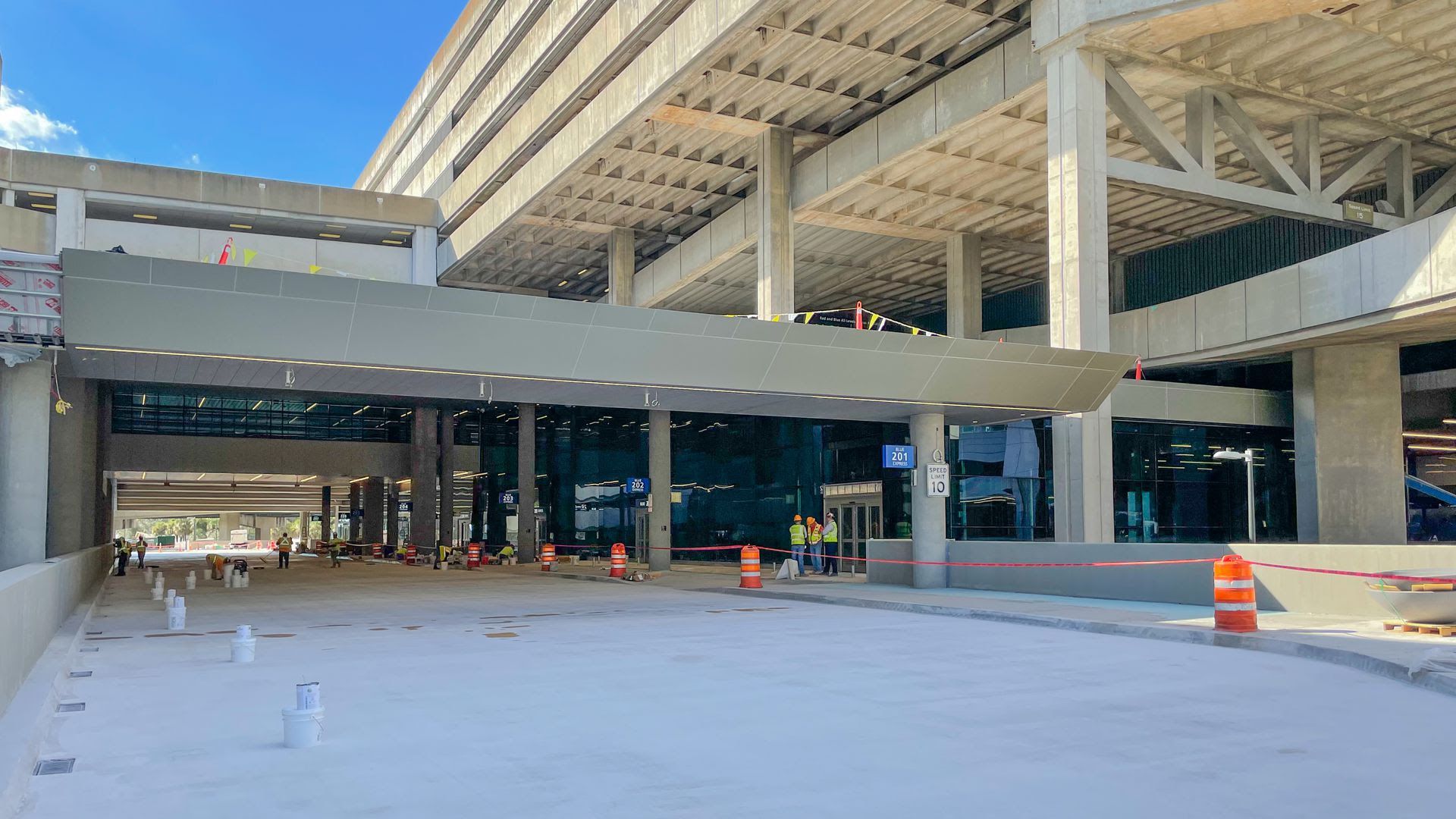 Construction of a bridge and escalator that is nearing completion on the new Blue Express Curbsides at Tampa International Airport. 