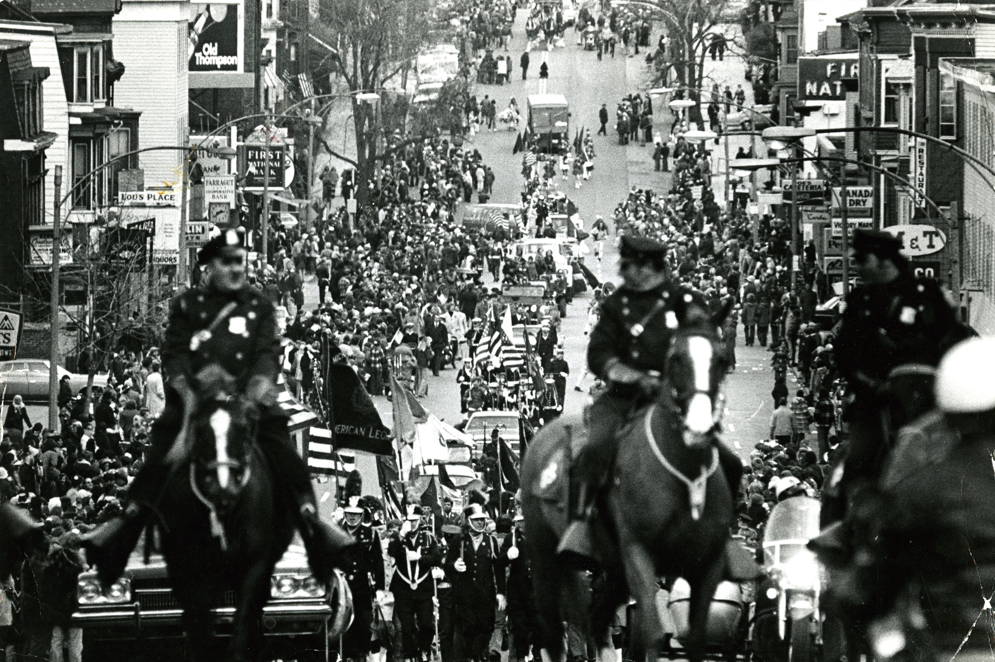 The Boston Police Department's Mounted Police Unit comes up East Broadway in the early 20th century during the South Boston St. Patrick's Day Parade.