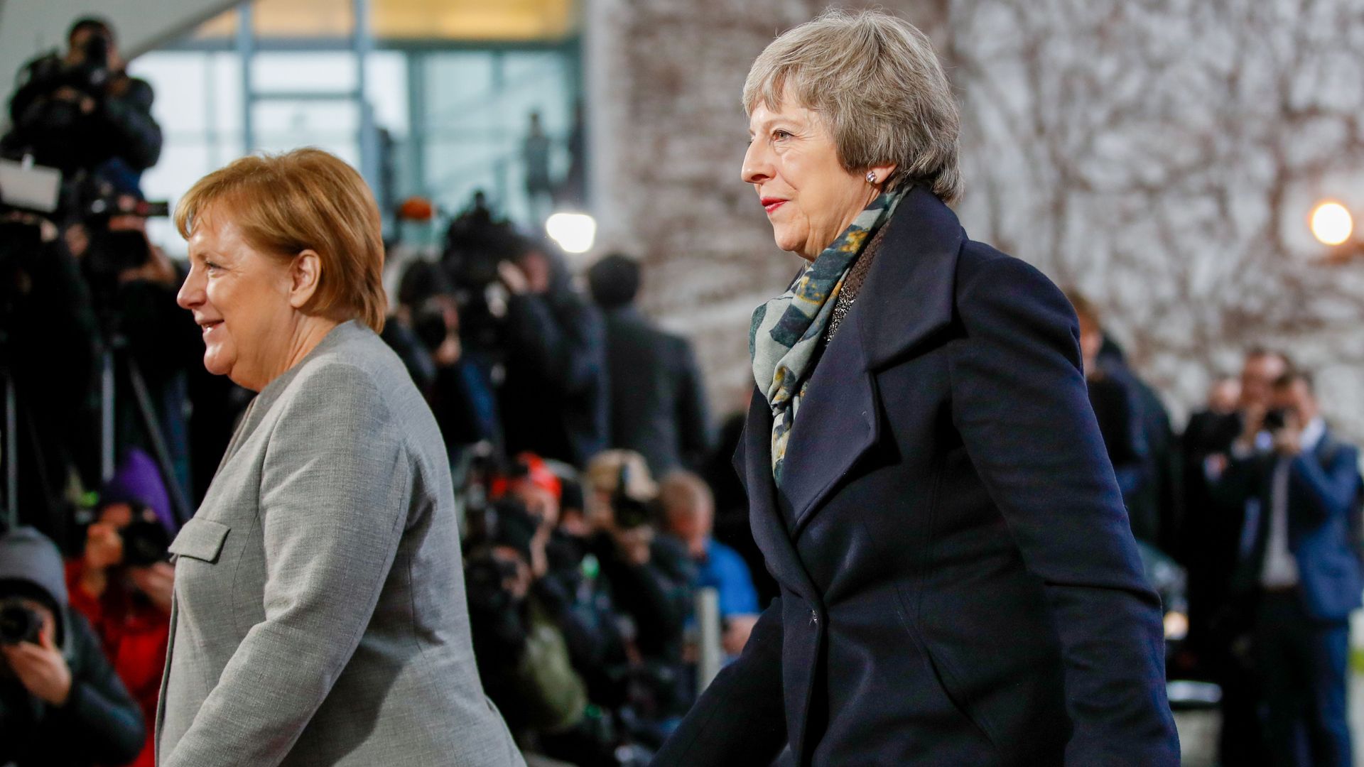 German Chancellor Angela Merkel (L) precedes British Prime Minister Theresa May after greeting her at the Chancellery in Berlin, on December 11, 2018, prior bilateral talks. 