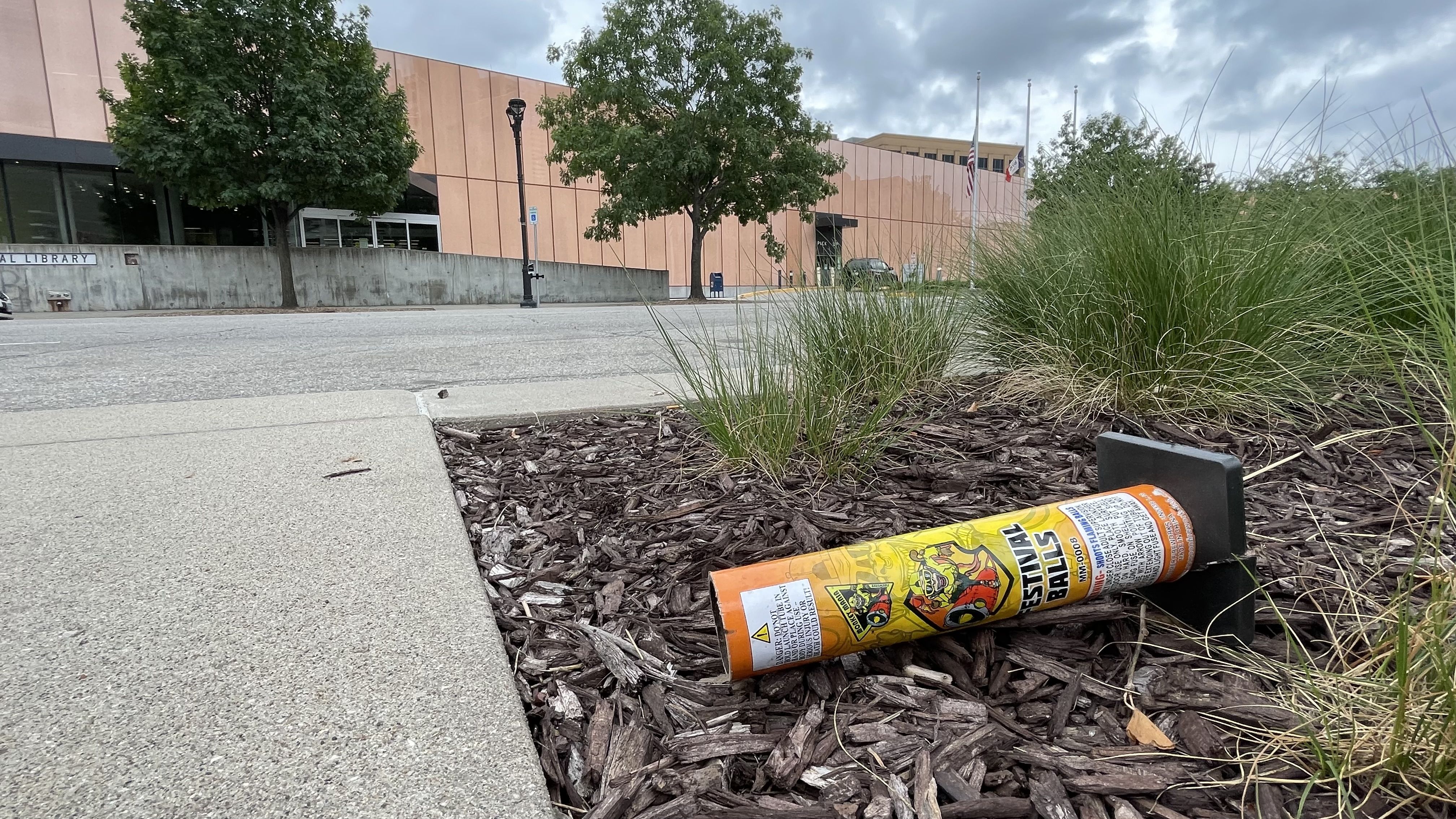 A photo of fireworks litter in front of the downtown Des Moines library.