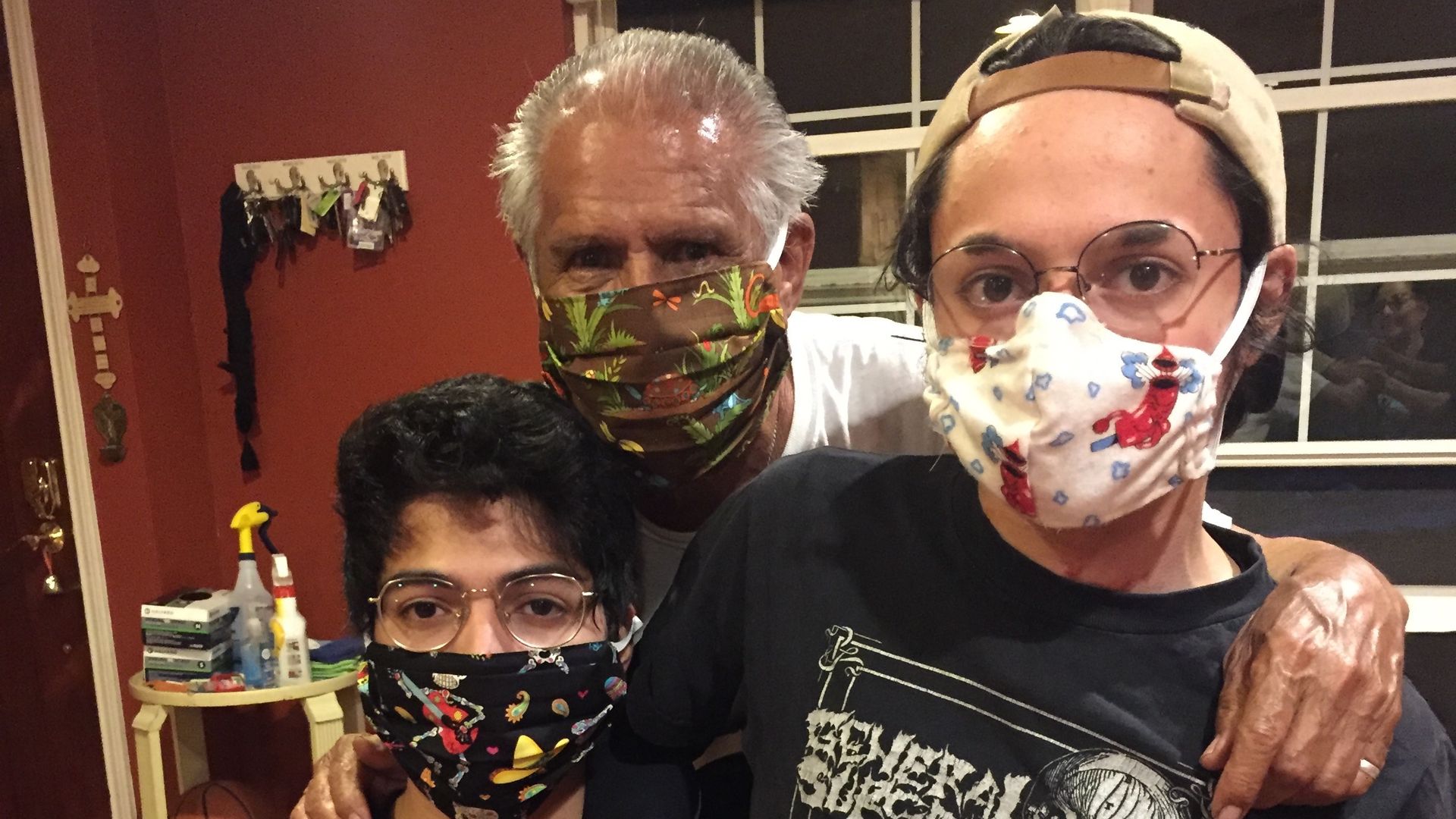 Fernando Rodriguezwith grandsons Ramón Rodriguez and Tín Rodriguez, wearing home-made masks at their home in Austin, Texas.