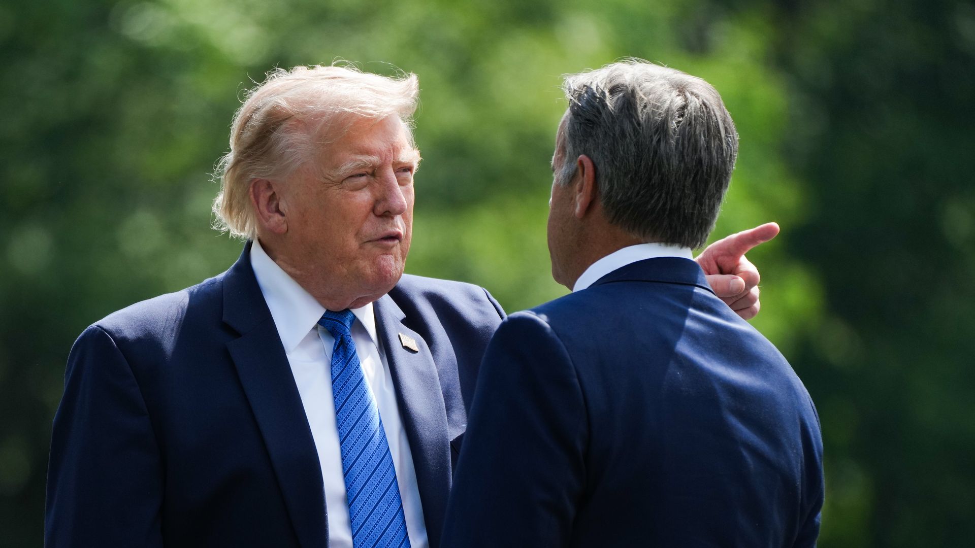 President Donald Trump and CIA Director John Ratcliffe speak as they depart after a Cabinet meeting at Camp David on July 31.