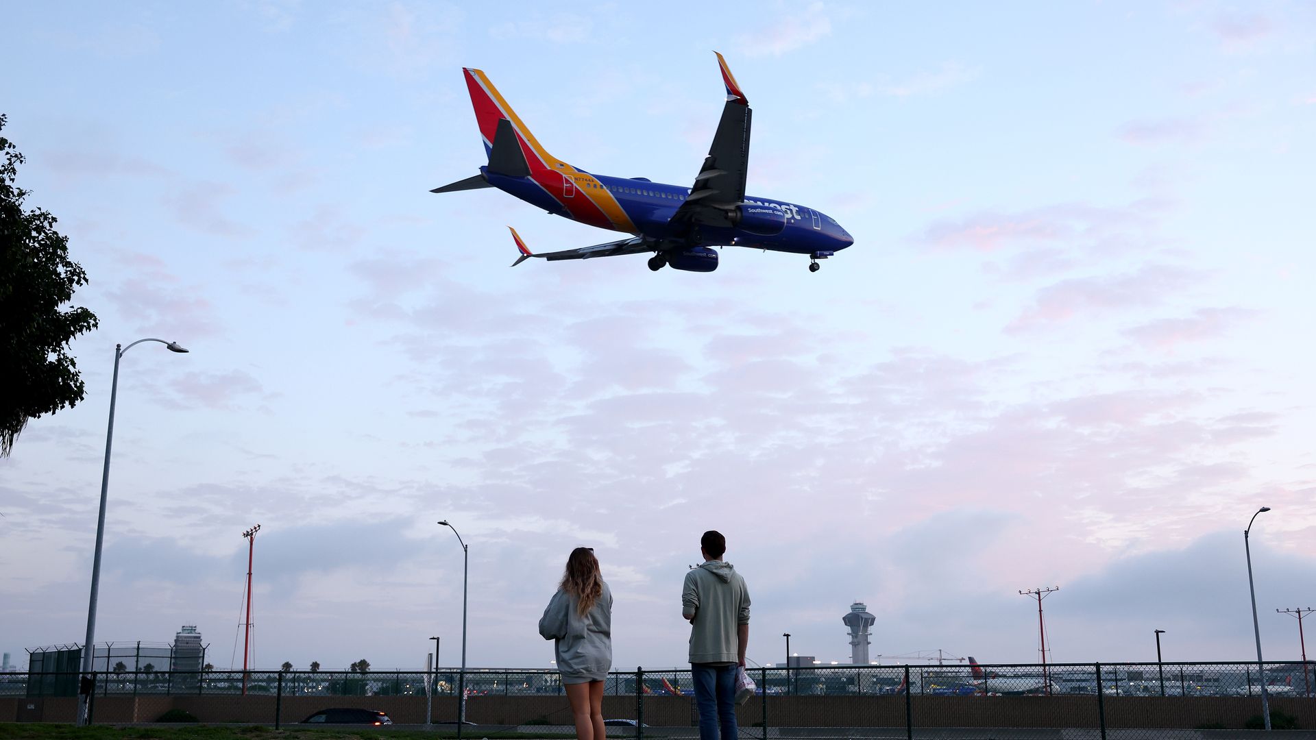 Onlookers watch as a Southwest Airlines flight lands at Los Angeles International Airport on August 31, 2023. Photo: Mario Tama/Getty Images