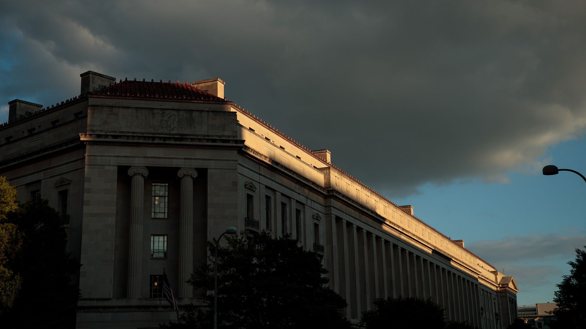 The headquarters of the Department of Justice under a dark sky