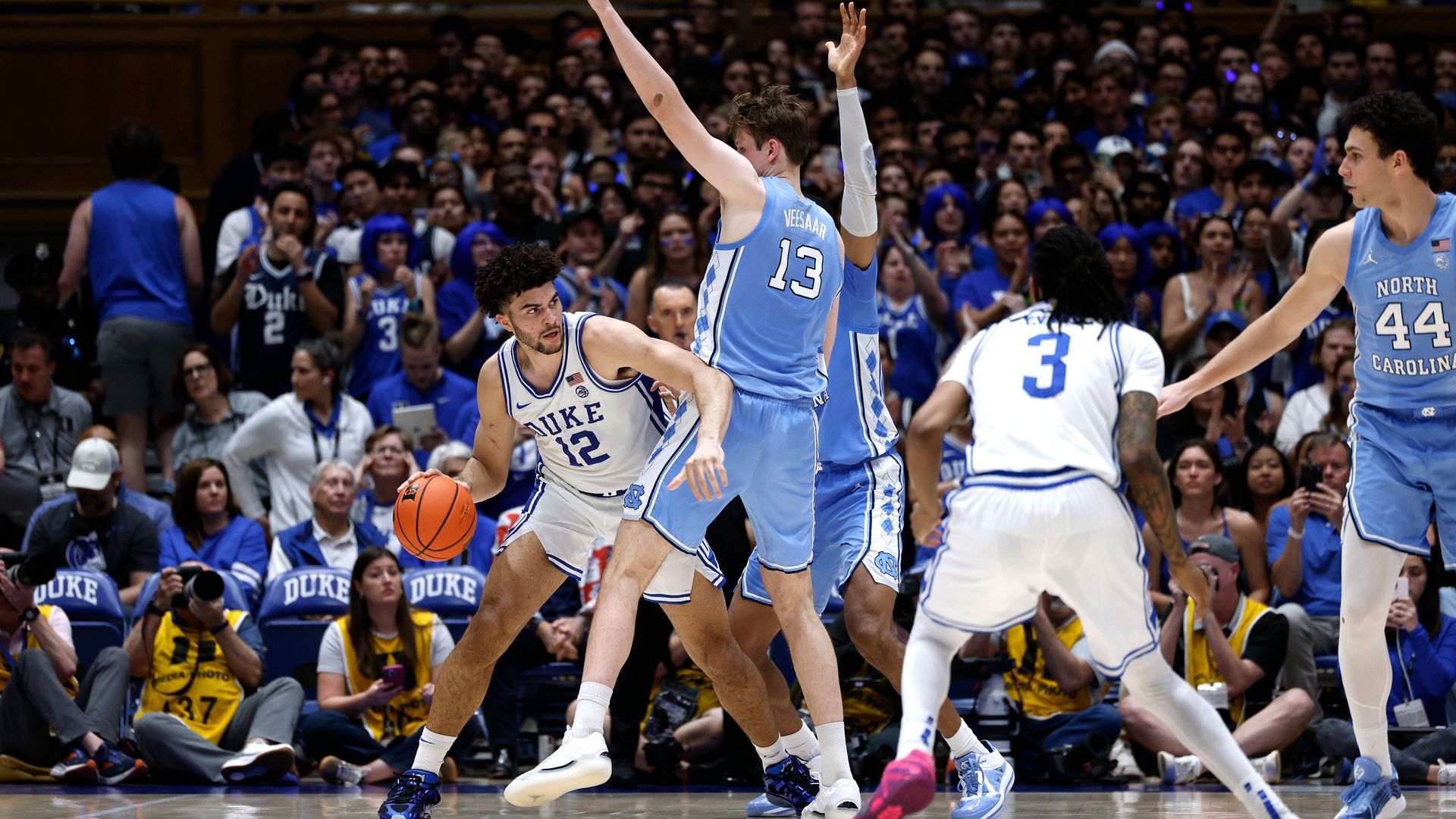 Cameron Boozer #12 of the Duke Blue Devils moves the ball around Henri Veesaar #13 of the North Carolina Tar Heels at Cameron Indoor Stadium on March 7, 2026 in Durham, North Carolina. (Photo by Lance King/Getty Images)