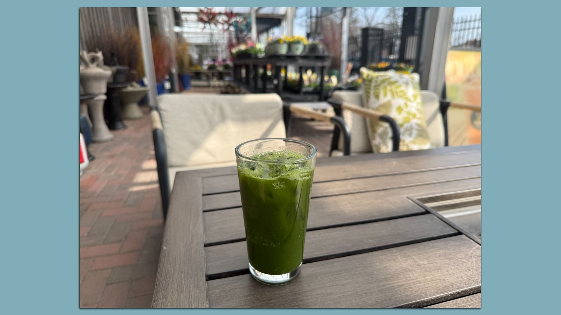 a green juice on a table