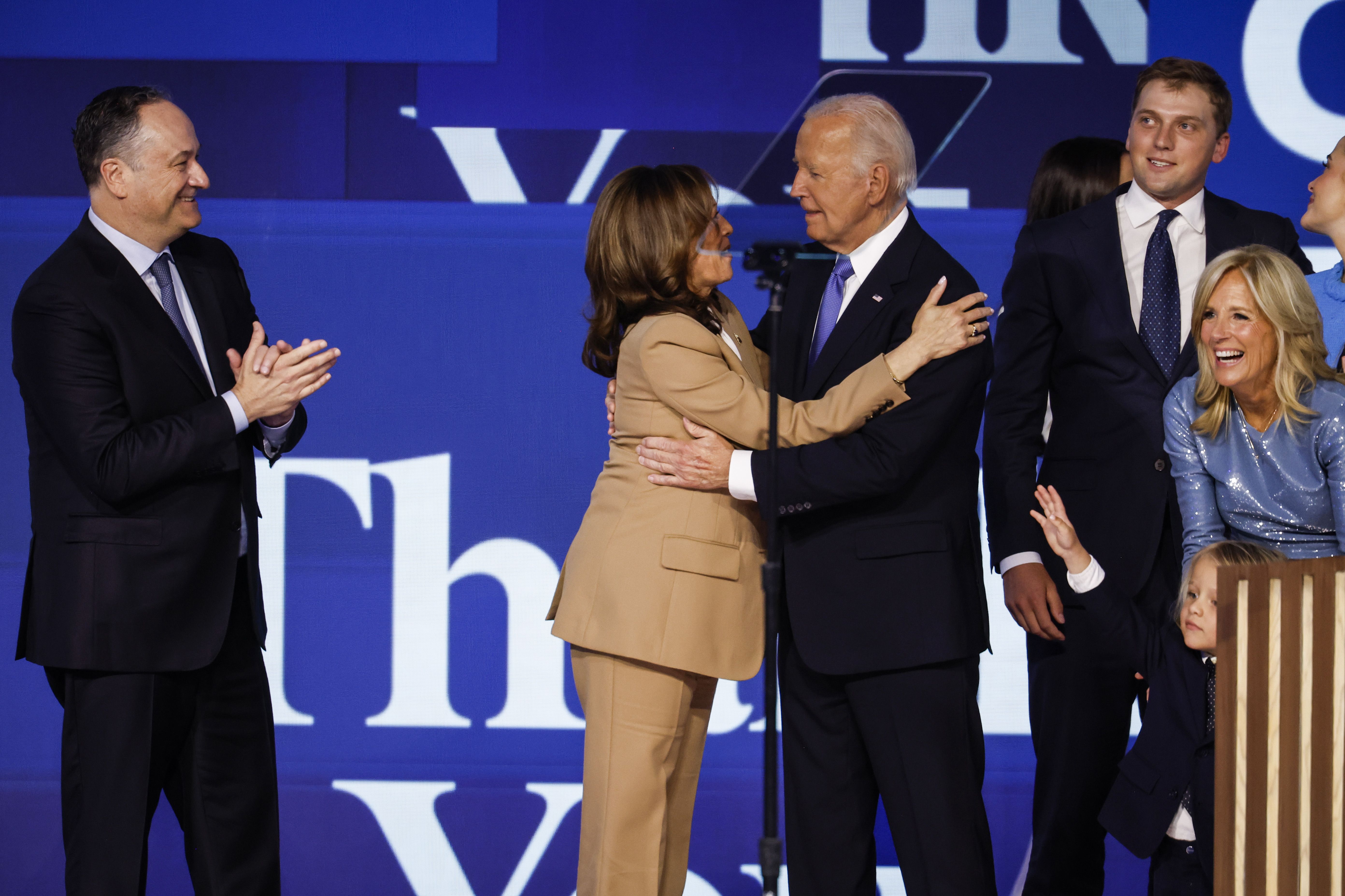 Democratic presidential candidate, U.S. Vice President Kamala Harris greets U.S. President Joe Biden after his speech as Second Gentleman Doug Emhoff (L) and First Lady Jill Biden (R) look on during the first day of the Democratic National Convention at the United Center on August 19 in Chicago.