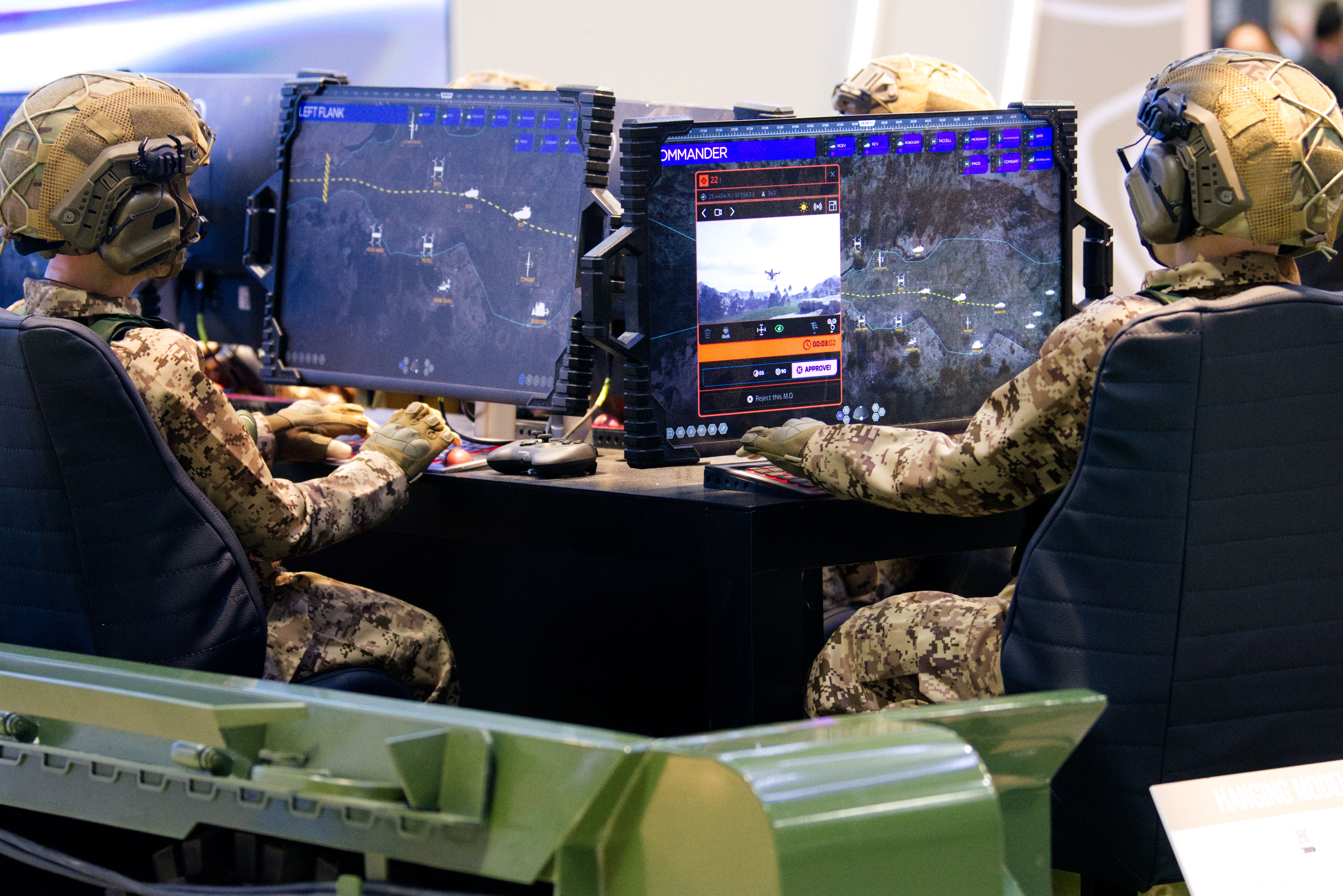 Dummies sit around a mocked-up vehicle. Computer screens can be seen.