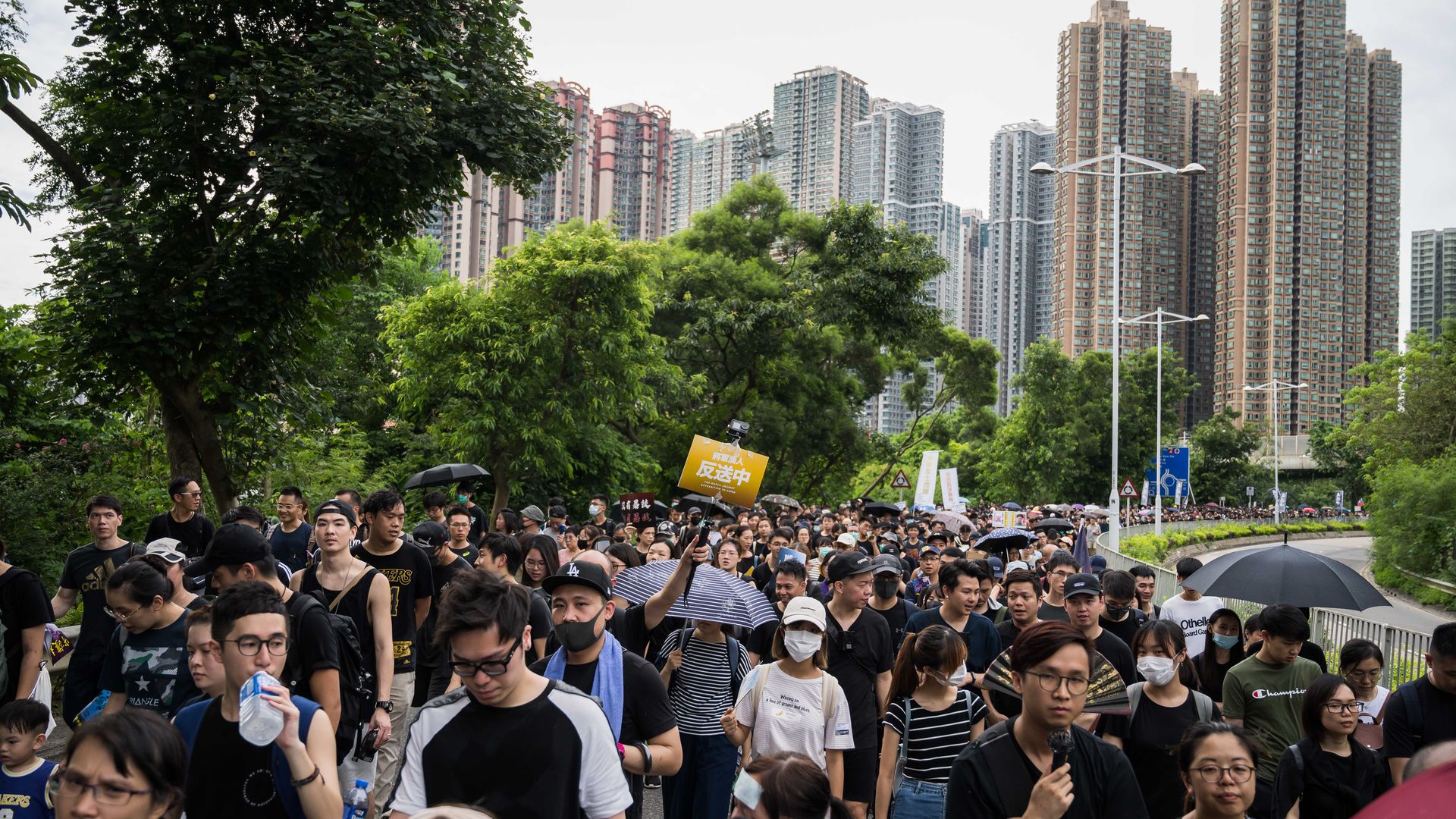 : Demonstrators march during a protest in the Tseung Kwan O district on Aug. 04, 2019 in Hong Kong