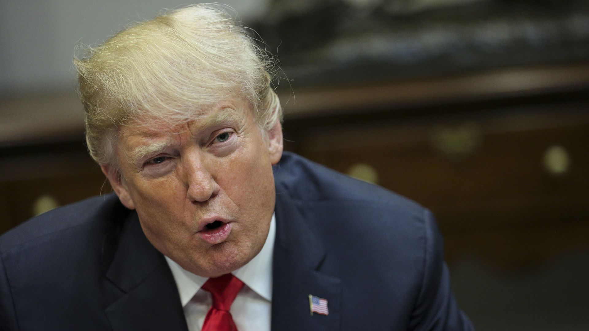 Trump leans in while speaking emphatically