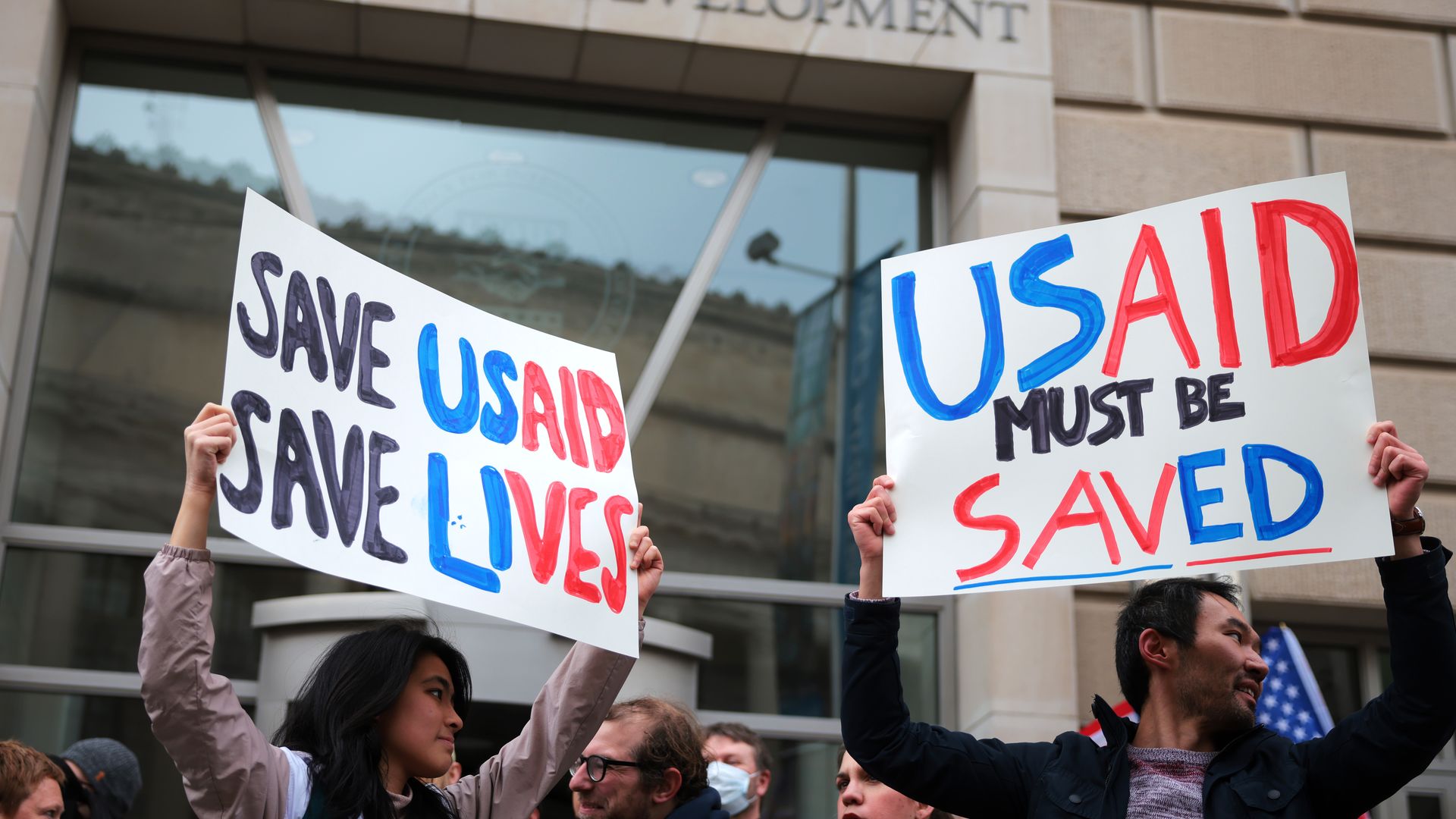 WASHINGTON, DC - FEBRUARY 03: Protestors gather outside of USAID headquarters on February 03, 2025 in Washington, DC. Elon Musk, tech billionaire and head of the Department of Government Efficiency (DOGE), said in a social media post that he and U.S. President Donald Trump will shut down the foreign