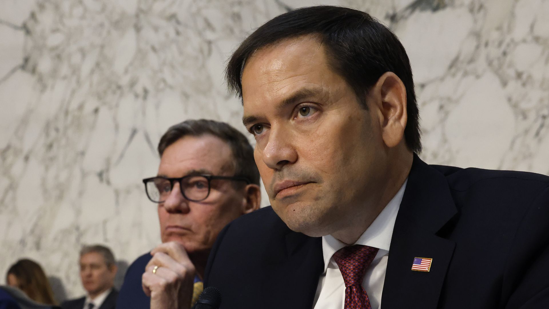 Senate Select Committee on Intelligence vice chairmen Sen. Mark Warner (D-VA) (L) and Sen. Marco Rubio (R-FL) lead an open hearing about global threats against the United States in the Hart Senate Office Building on Capitol Hill on March 11, 2024 in Washington, DC.