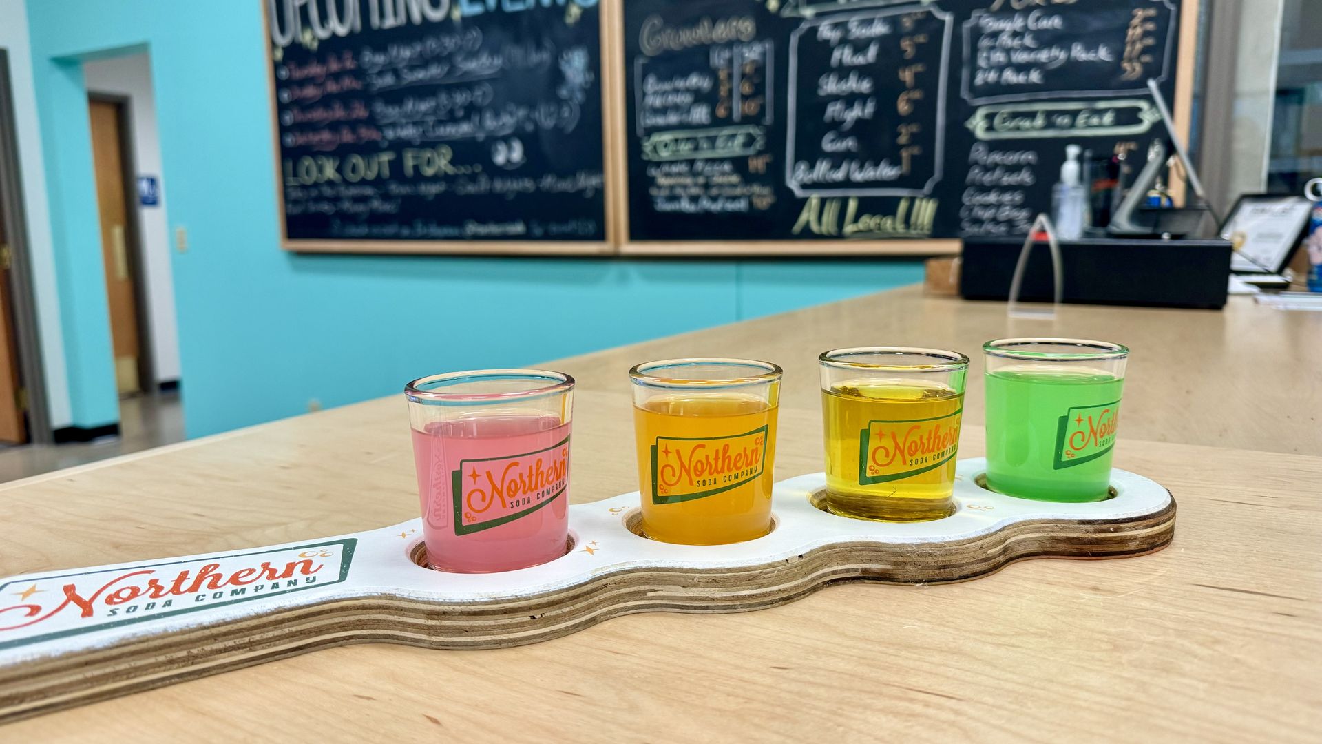 A photo of four sodas.