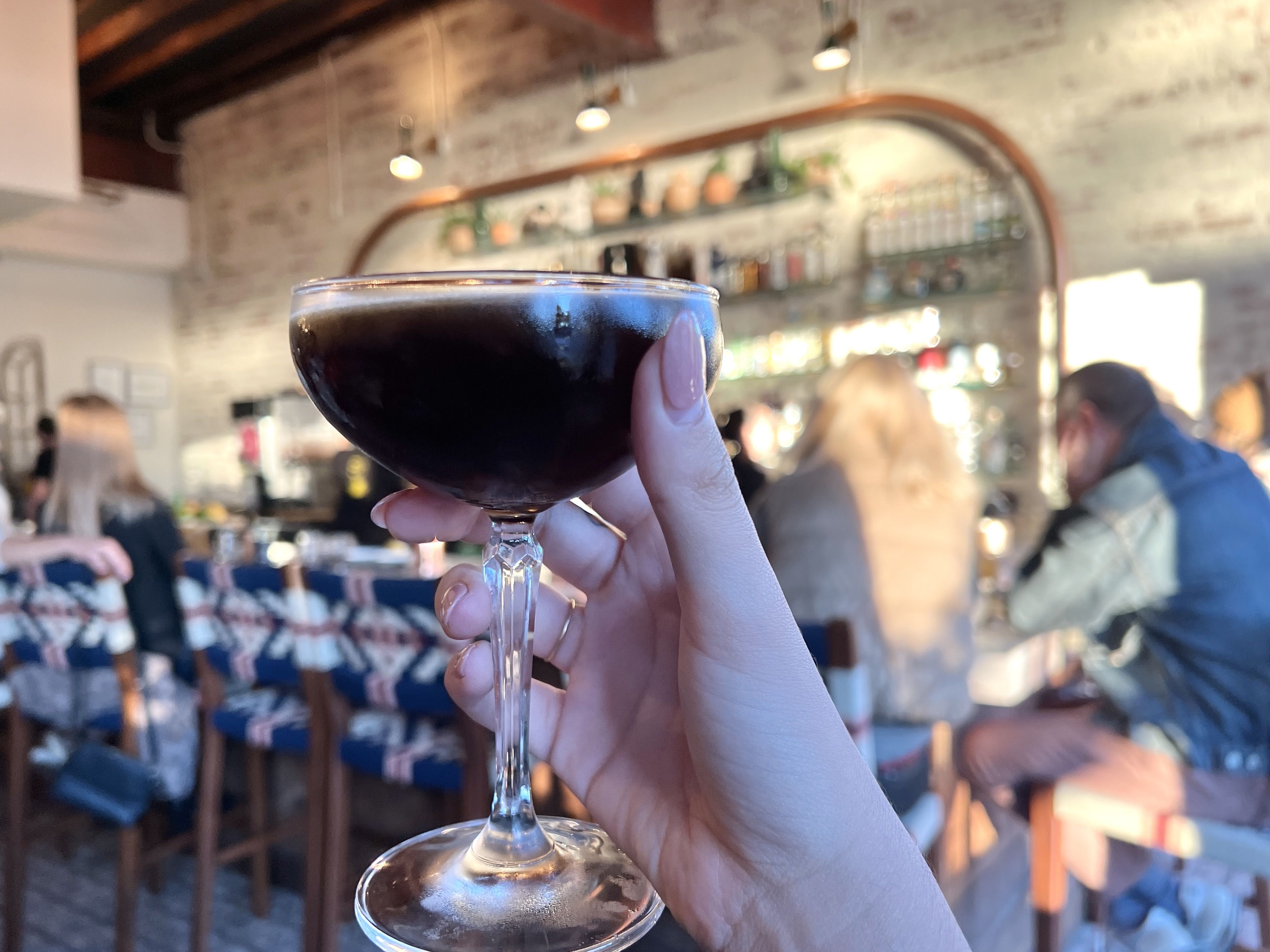 hand holding espresso martini