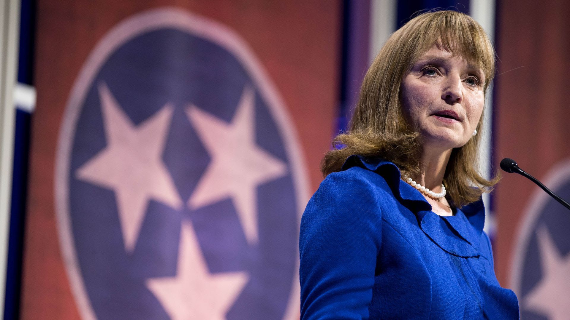Former Tennessee Speaker of the House Beth Harwell talks on a podium.