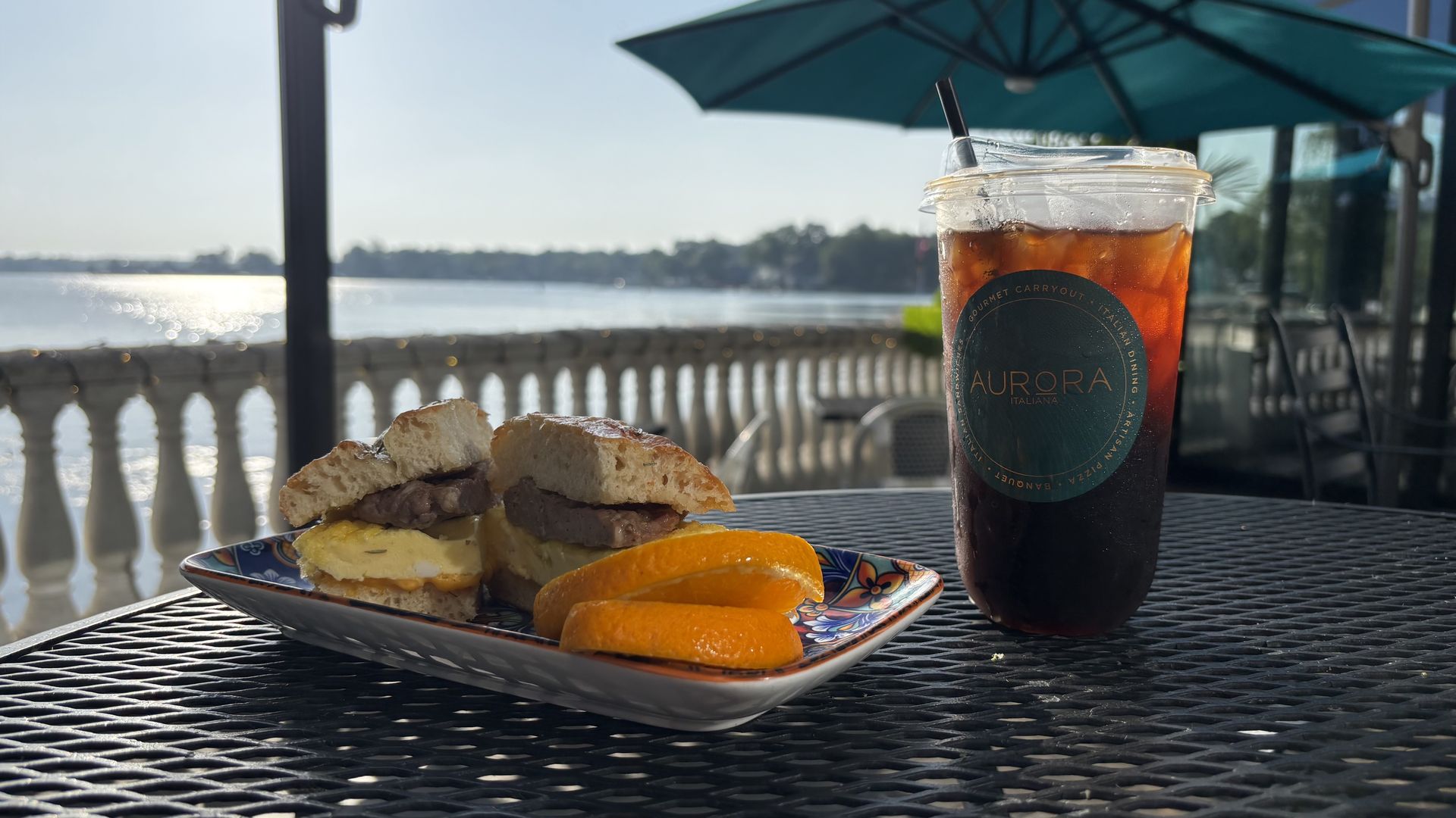 Joe's iced coffee and breakfast sandwich at Café Aurora.