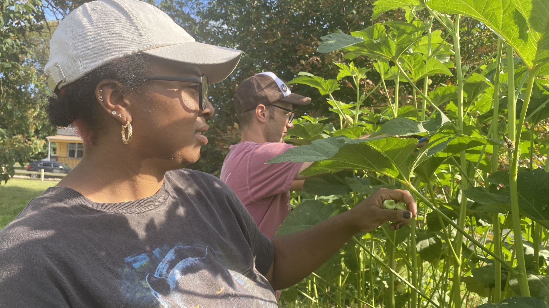 Tonii Hicks and Ben Miller tend to one of their community gardens Oct. 2, 2021