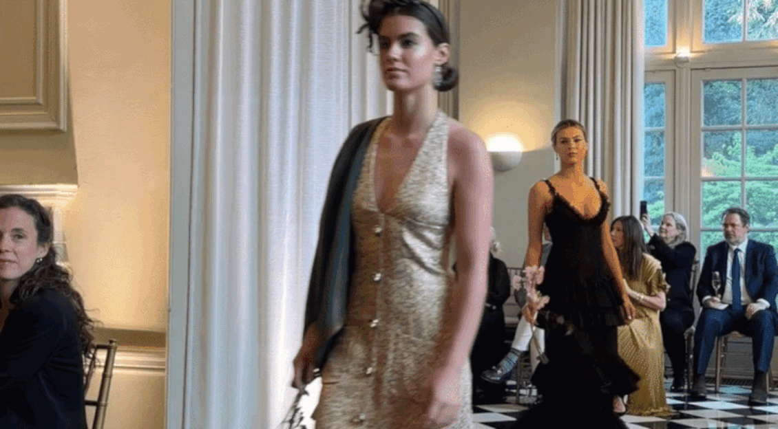 video of models walking into a room