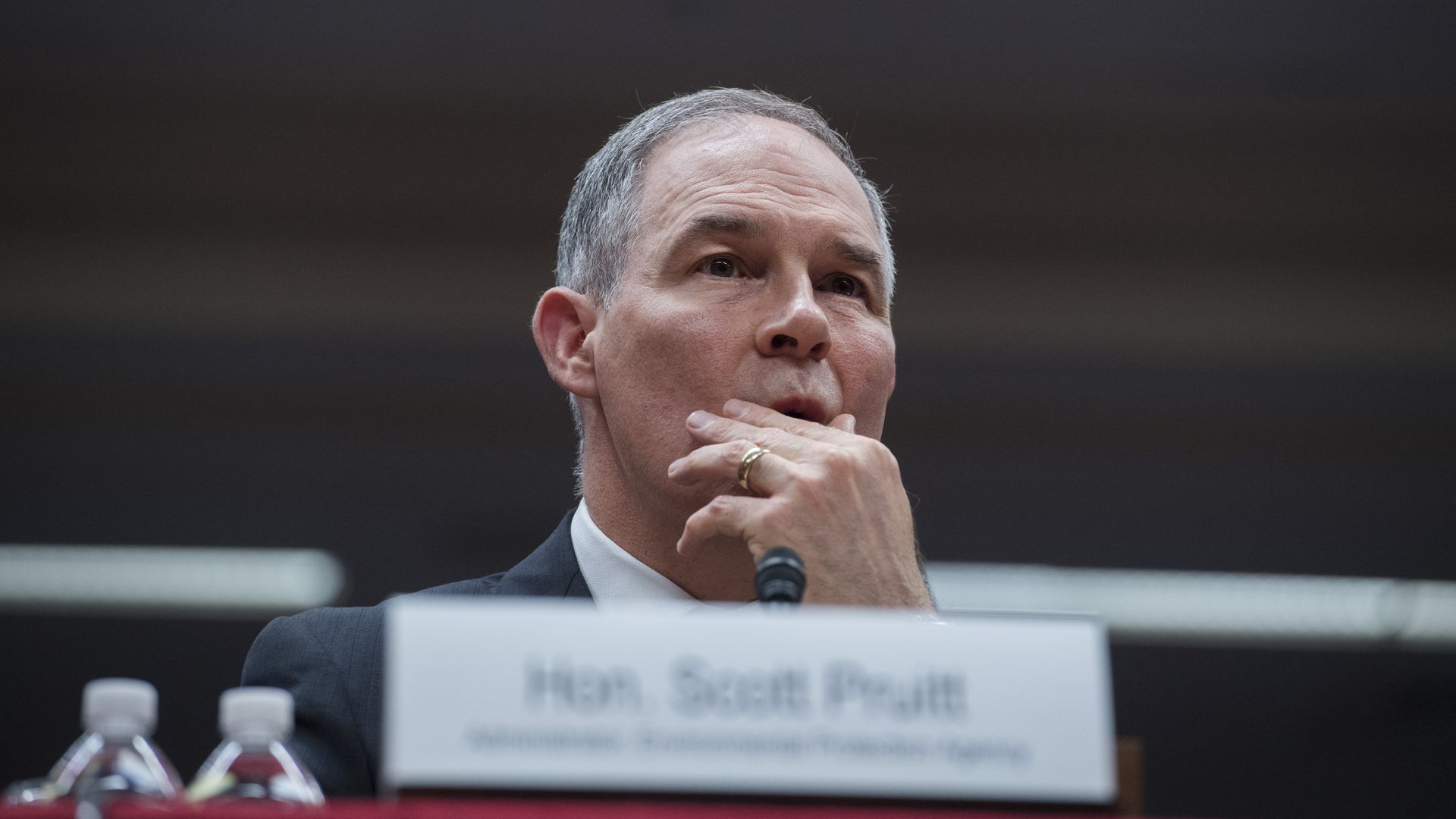 In this image, Scott Pruitt rubs his face at a hearing.