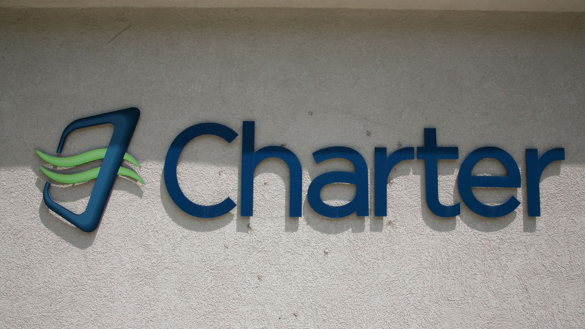 Charter Communications logo on a building