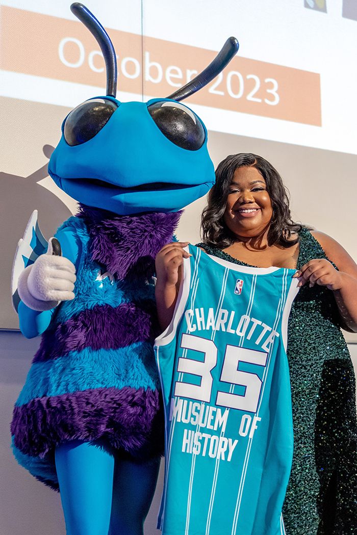 Hugo the Hornet (left) and Terri L. White, Charlotte Museum of History president and CEO, announcing the "Hive at 35" exhibit. Photo courtesy of the Charlotte Museum of History 