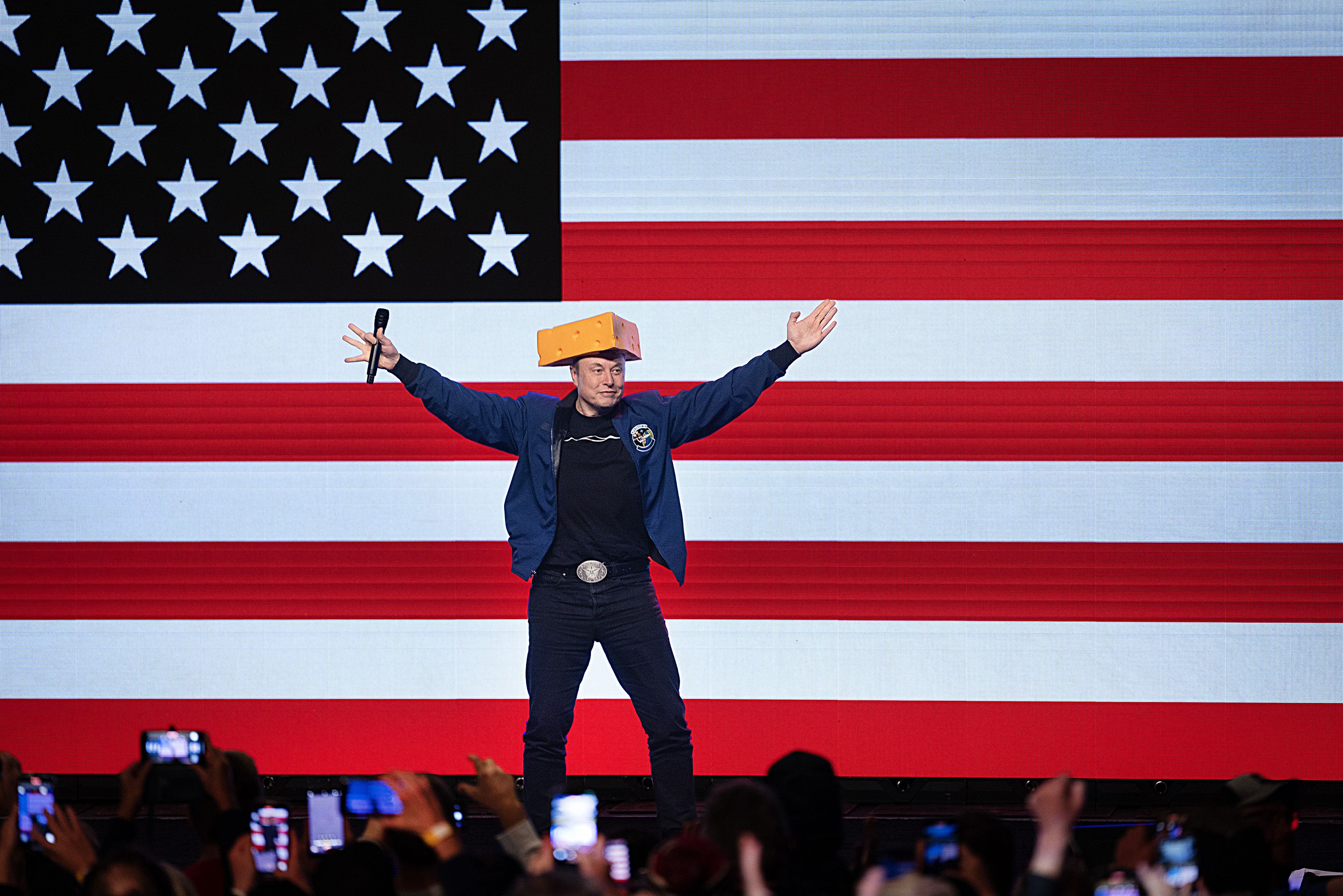 GREEN BAY, WISCONSIN - MARCH 30: Billionaire businessman Elon Musk arrives for a town hall meeting wearing a cheesehead hat at the KI Convention Center on March 30, 2025 in Green Bay, Wisconsin. The town hall is being held in front of the state's high-profile Supreme Court election between Circuit C