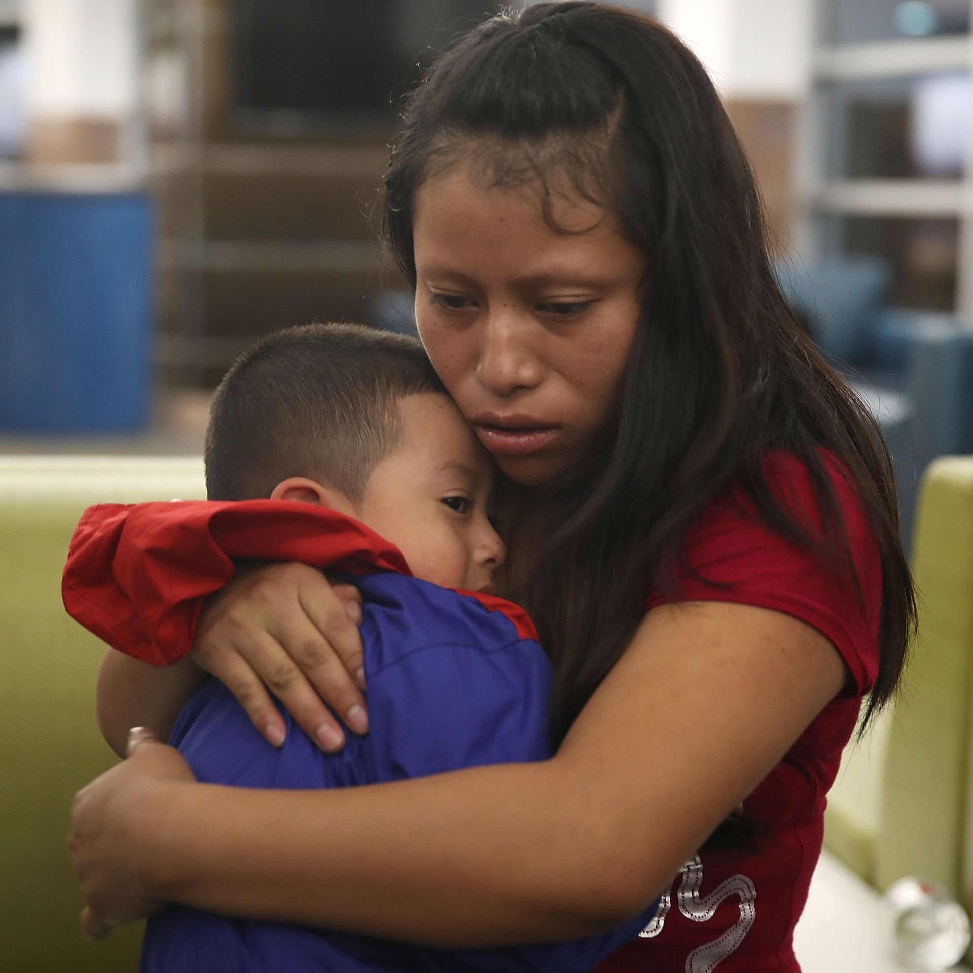 A woman, identified only as Maria, is reunited with her son, 4, at the El Paso International Airport.