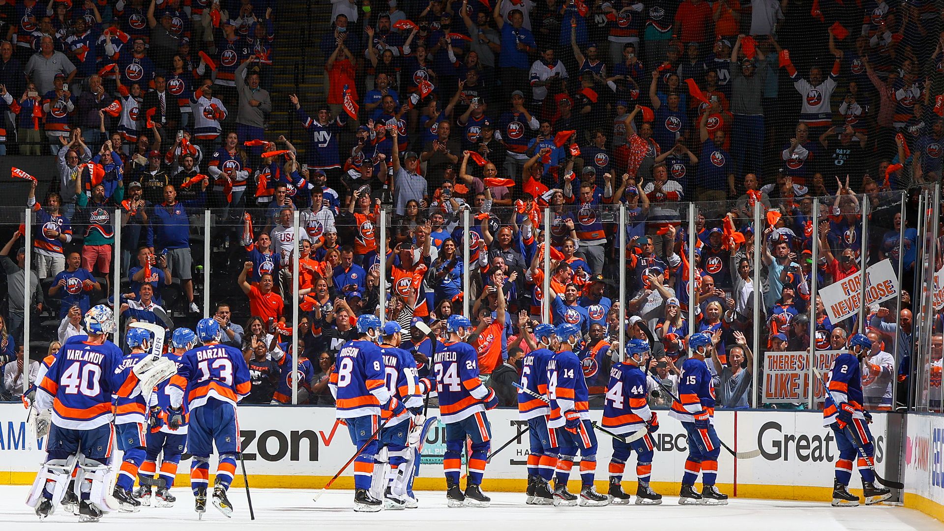 islanders celebrating with fans after win