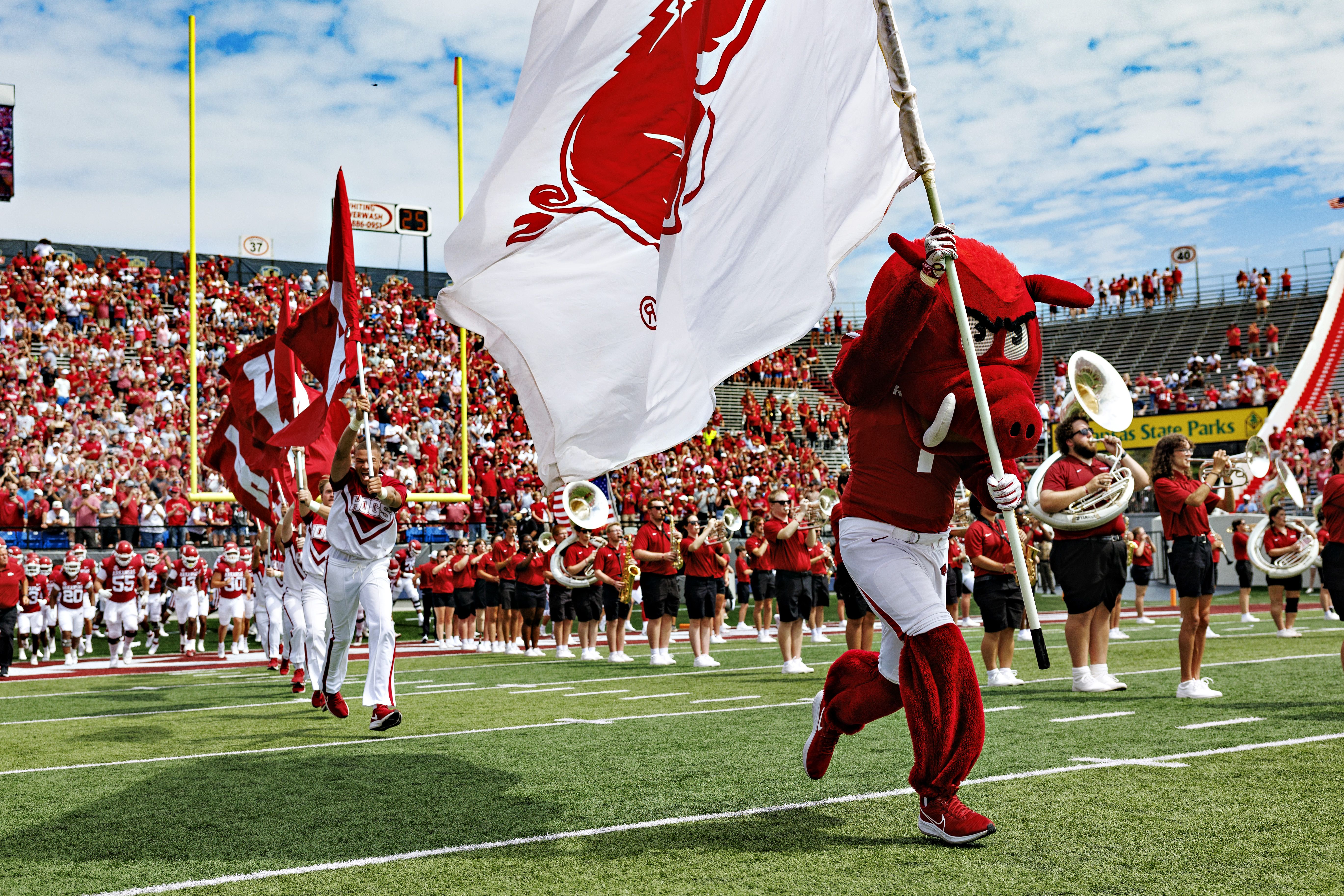 Mascot Big Red of the Arkansas Razorbacks leads the team onto the field before a game against the Western Carolina Catamounts at War Memorial Stadium on September 02, 2023 in Little Rock, Arkansas. The Razorbacks defeated the Catamounts 56-13. (Photo by Wesley Hitt/Getty Images)