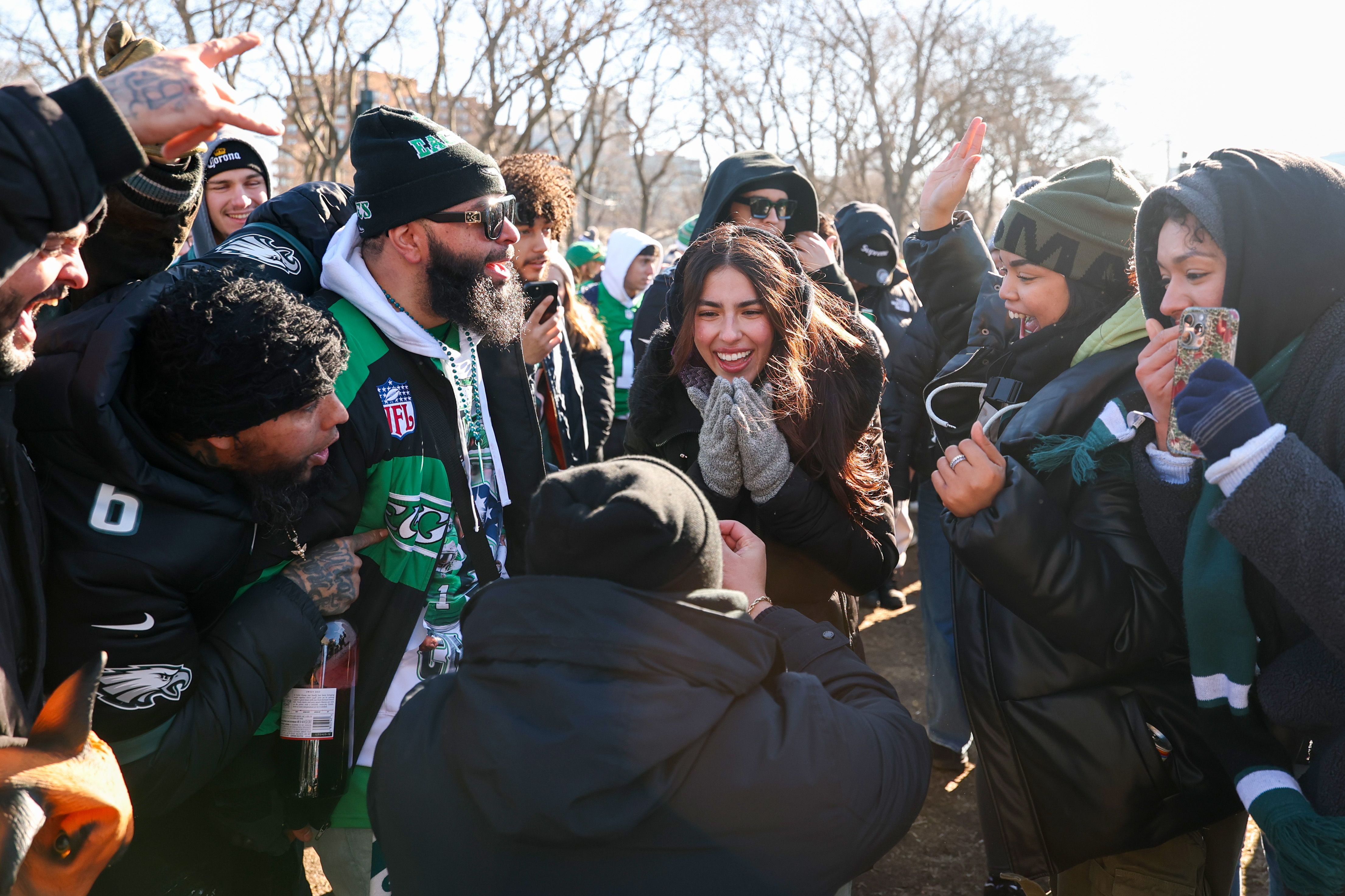 A couple gets engaged in the middle of a crowd during the Eagles Super Bowl parade.