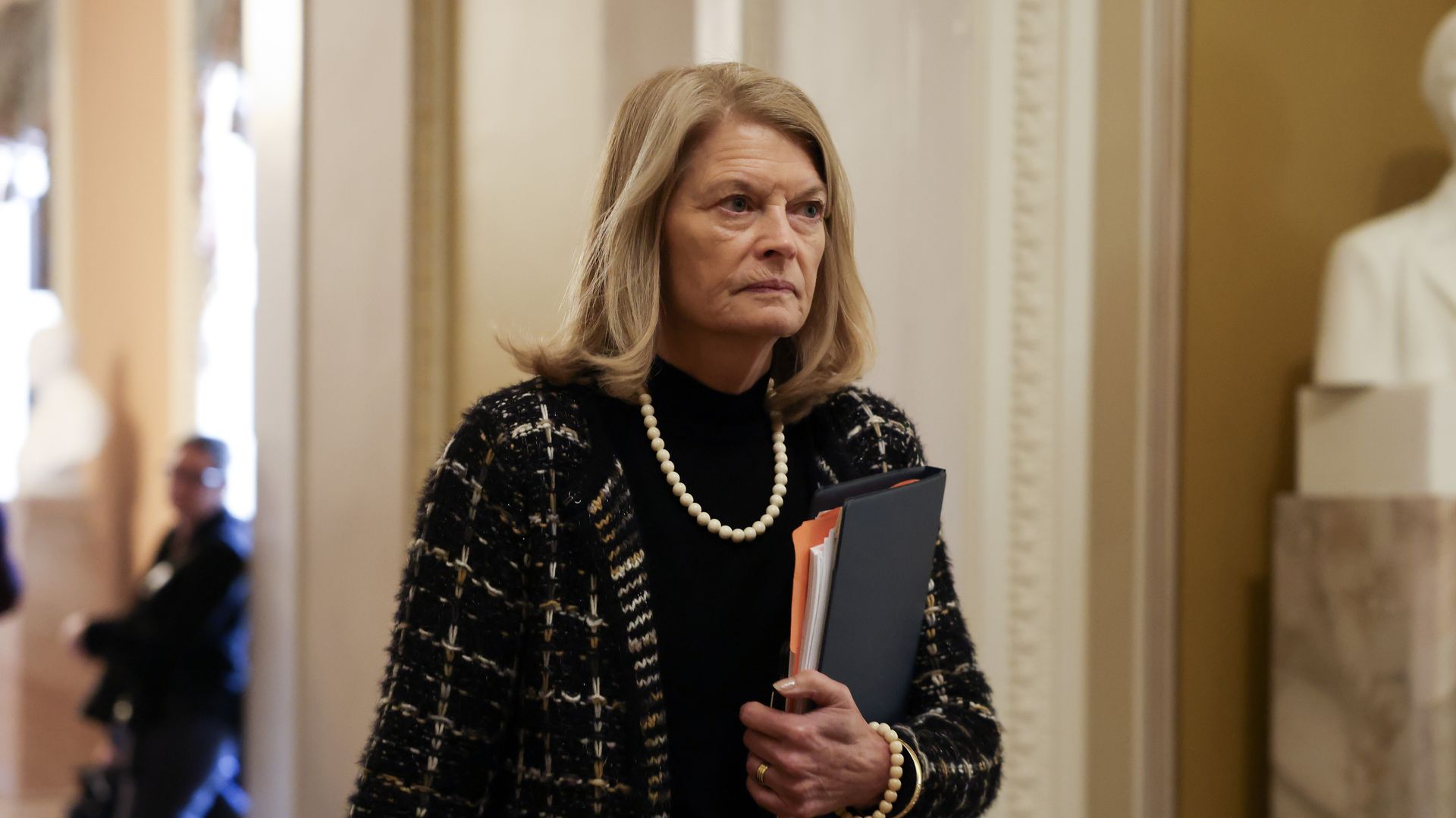 Lisa Murkowski walks on Capitol Hill.