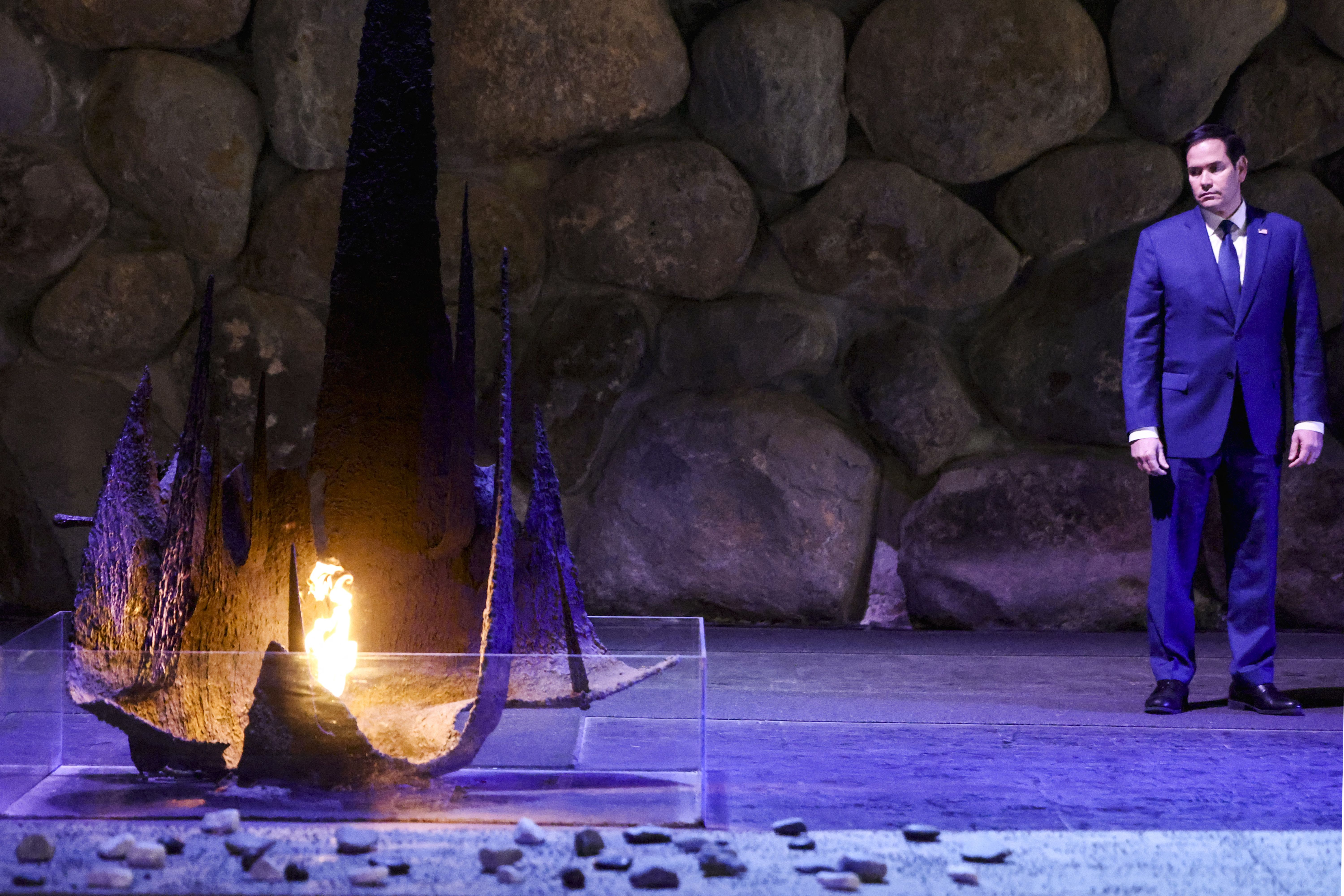 US Secretary of State Marco Rubio stands near the Eternal Flame at the Hall of Remembrance at the Yad Vashem Holocaust Memorial museum in Jerusalem on February 16, 2025. (Photo by Evelyn Hockstein / POOL / AFP) (Photo by EVELYN HOCKSTEIN/POOL/AFP via Getty Images)
