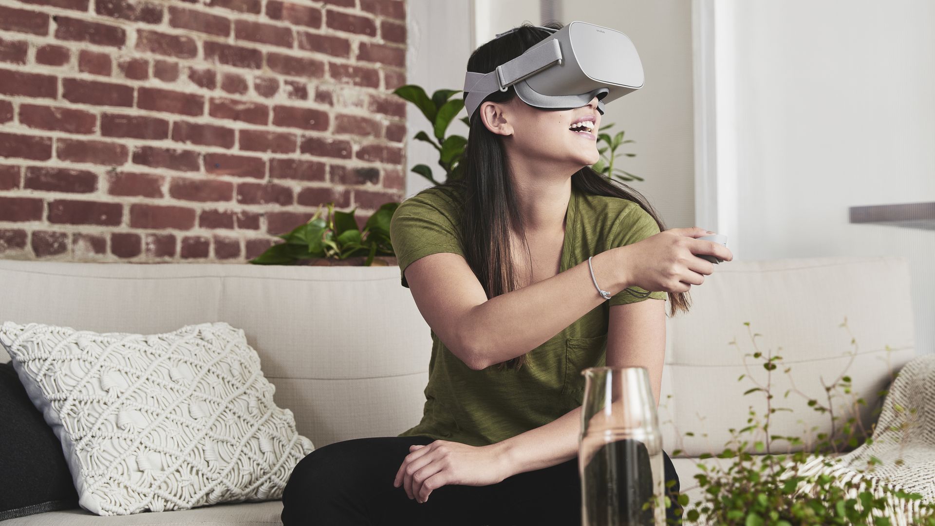 A woman wearing an Oculus Go VR headset