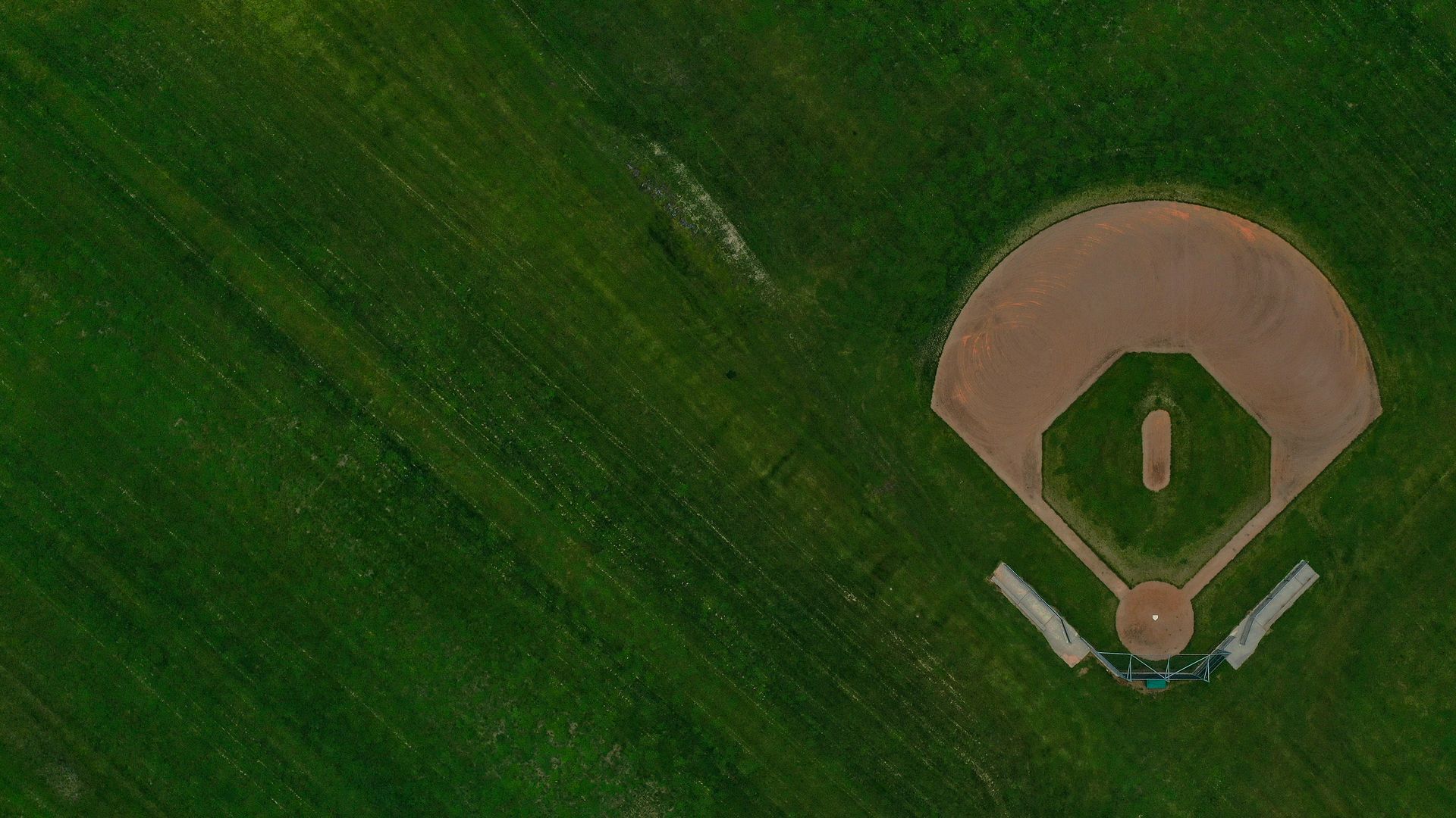 : An aerial view of a rural recreational baseball field is seen empty