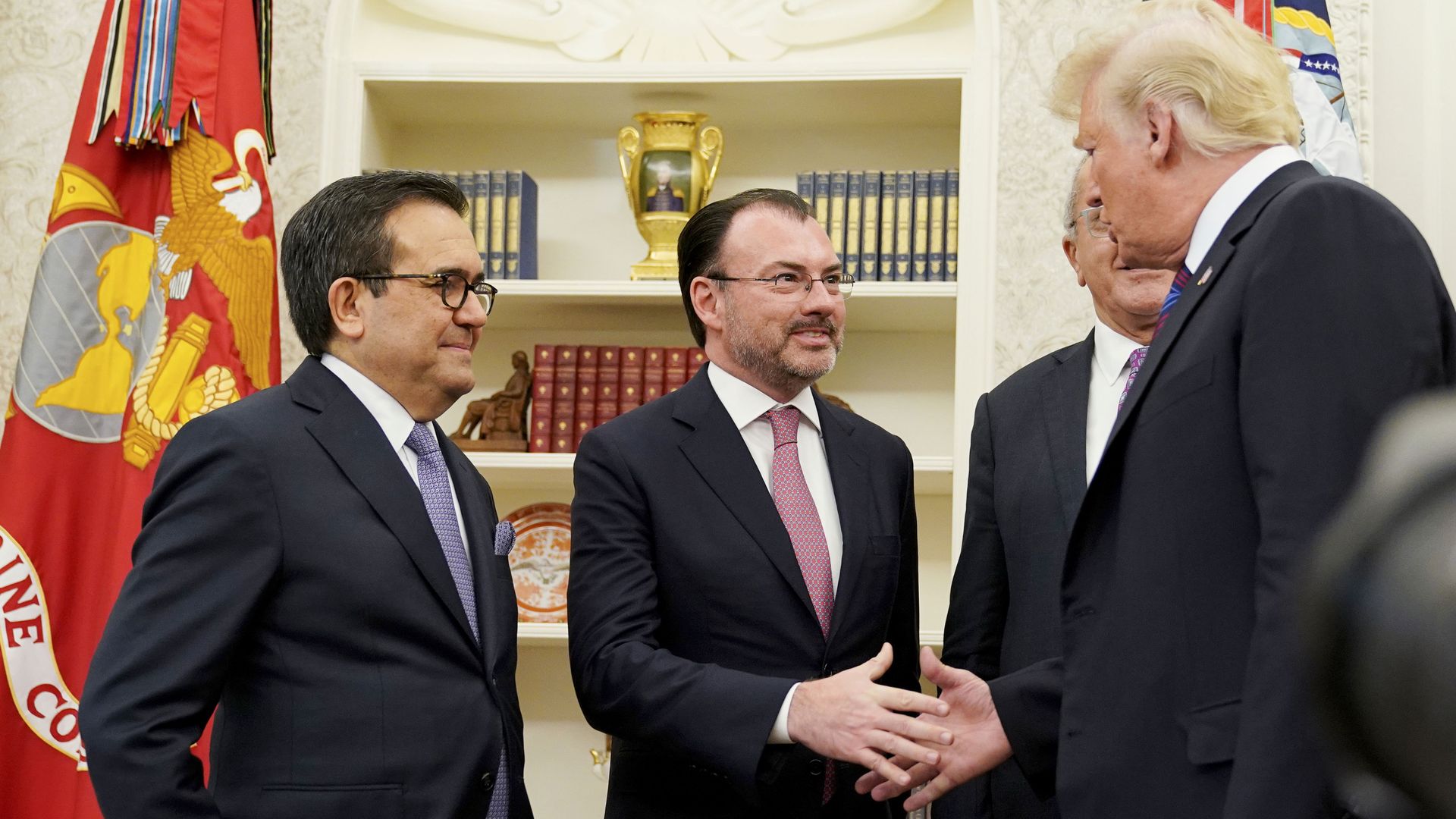 US President Donald Trump shakes hands with Mexico's Foreign Minister Luis Videgaray Caso as he arrives to speak on trade in the Oval Office.