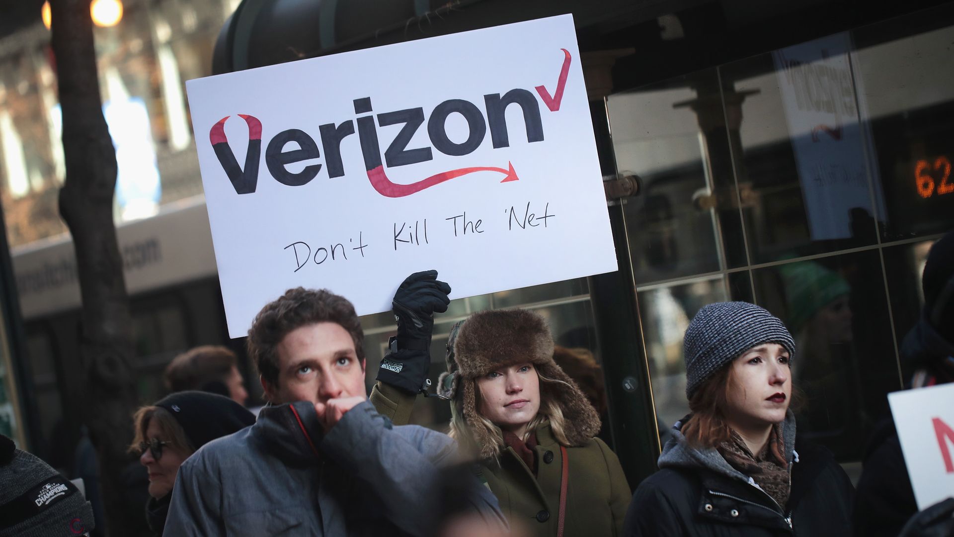 Demonstrators, supporting net neutrality, protest a plan by the FCC to repeal restrictions on internet service providers