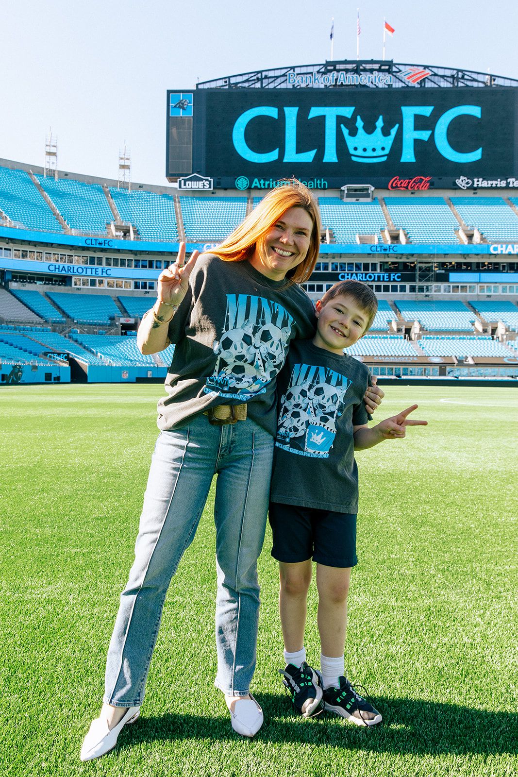 Girl Tribe co-founder Carrie Barker and her child at Bank of America Stadium.