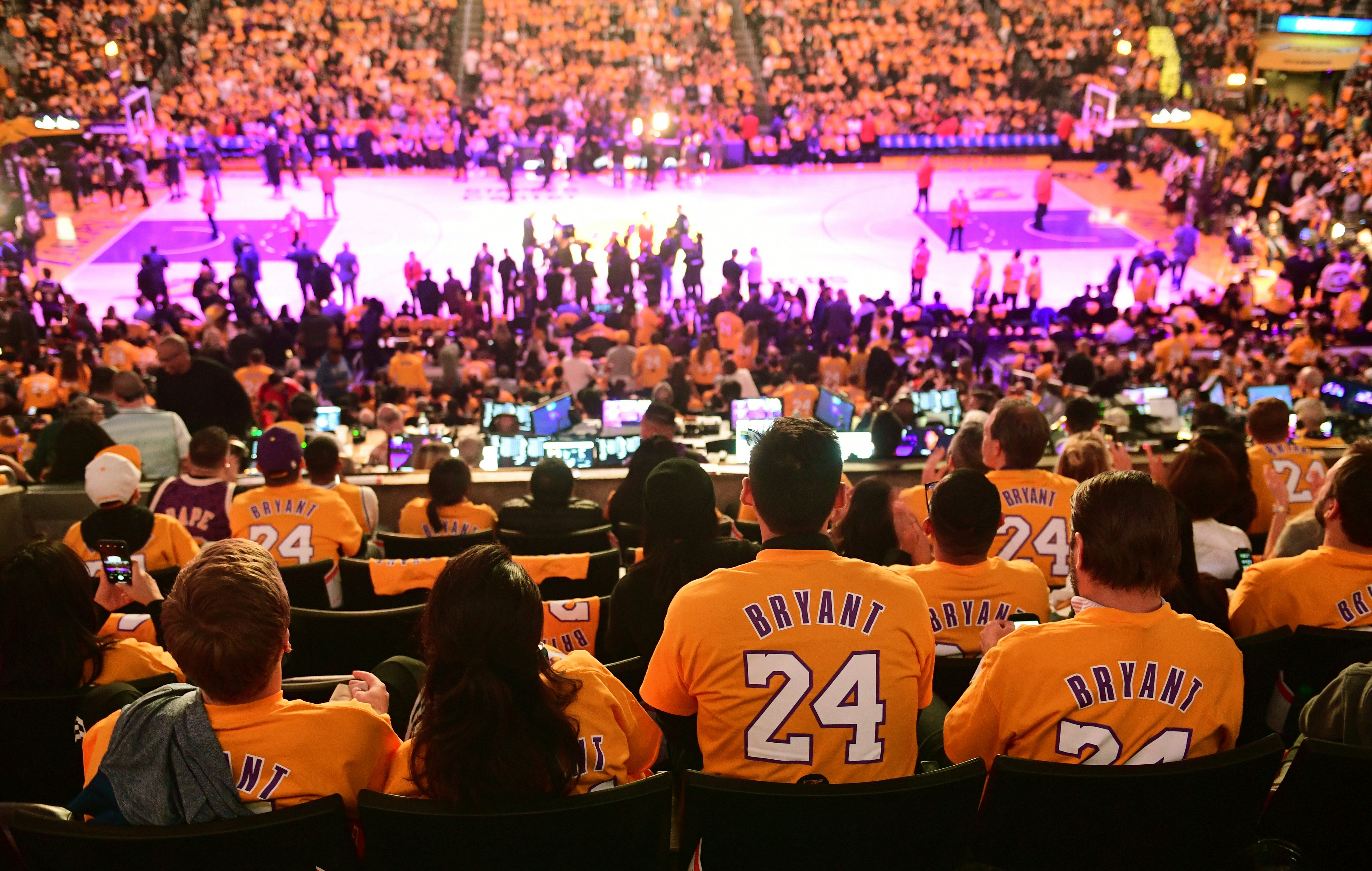 In this image, Lakers fans wear Bryant jerseys at the game