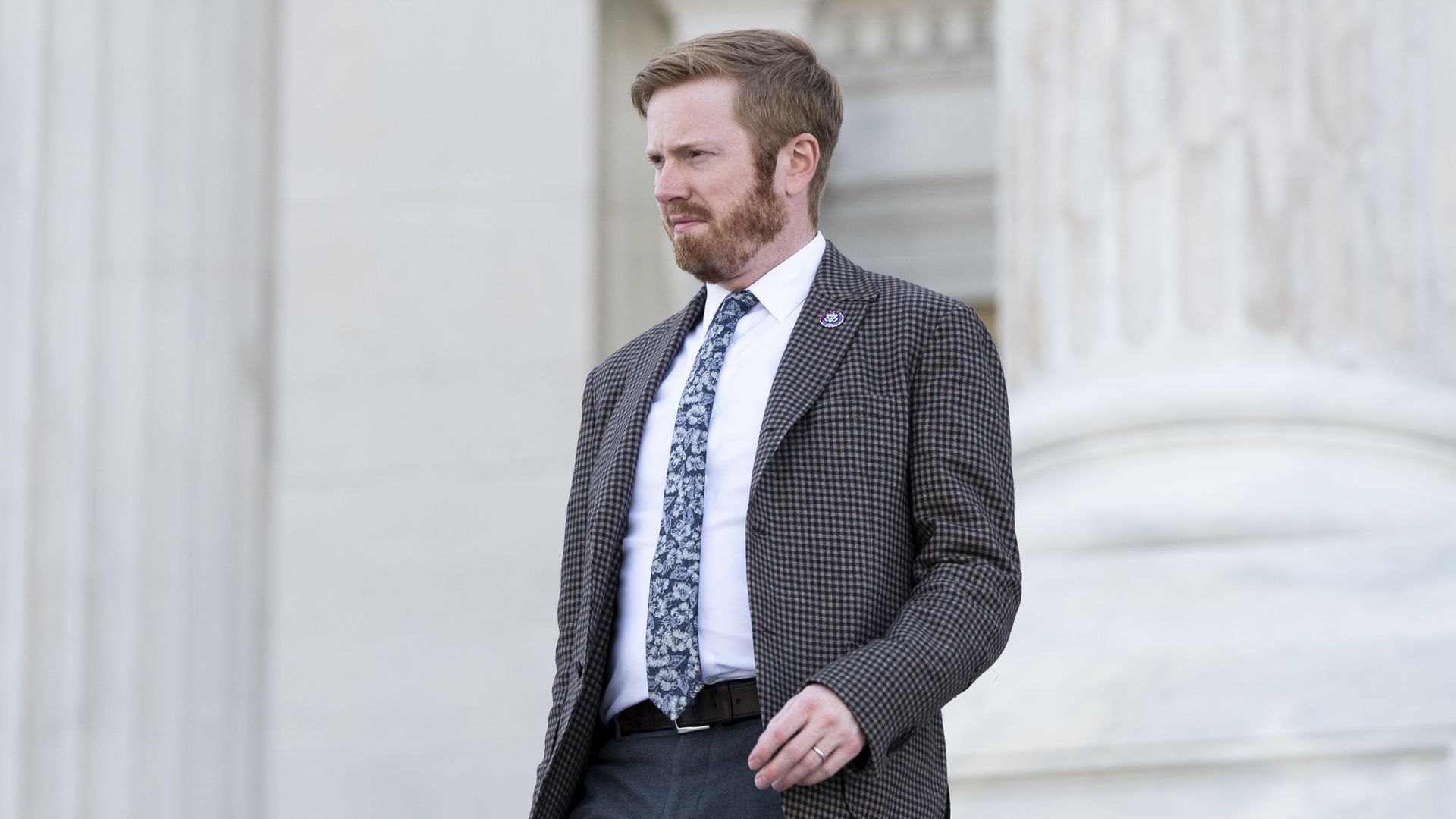 Rep. Peter Meijer is seen walking down the steps of the U.S. Capitol.
