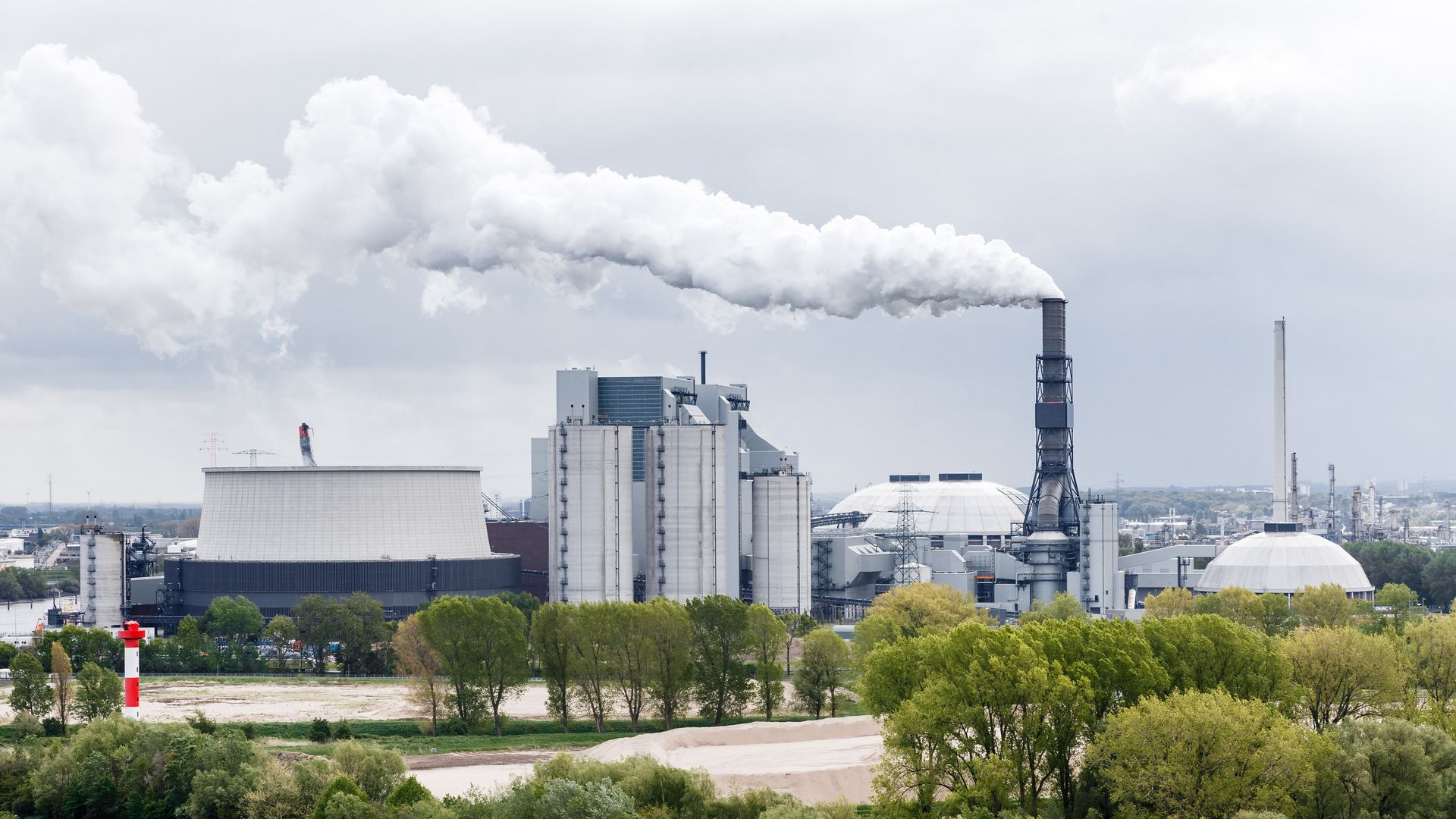 smoke billowing out from a coal-fired power plant