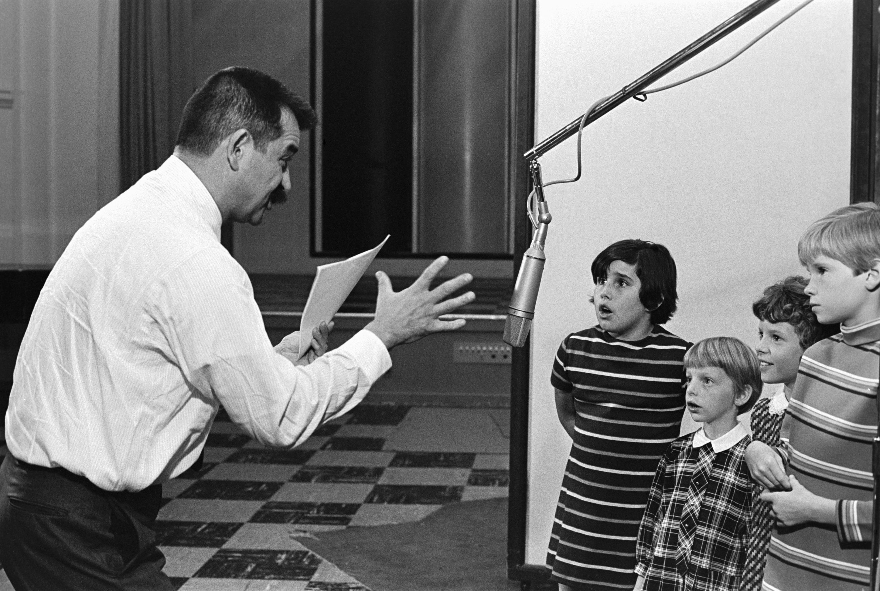Producer Bill Melendez directs children who are recording the dialogue for the animated TV special, "It's the Great Pumpkin, Charlie Brown."