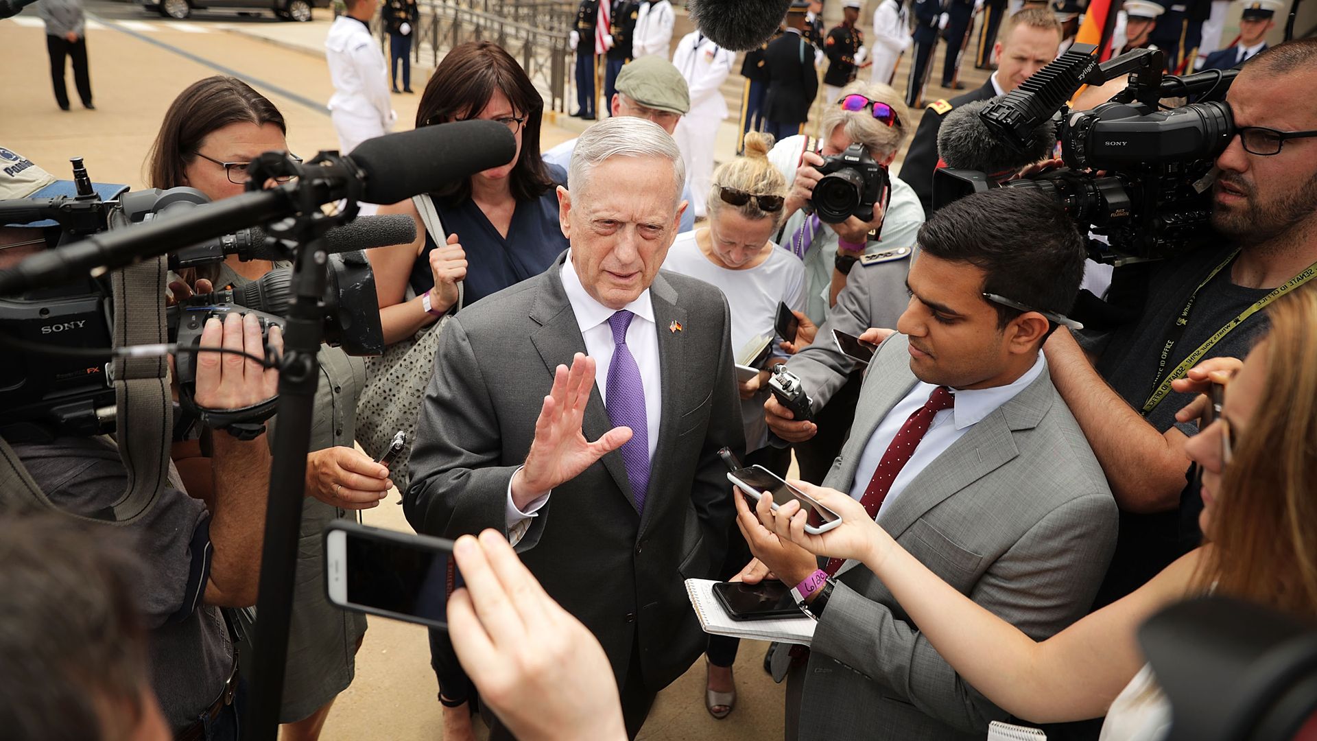 James Mattis surrounded by press.