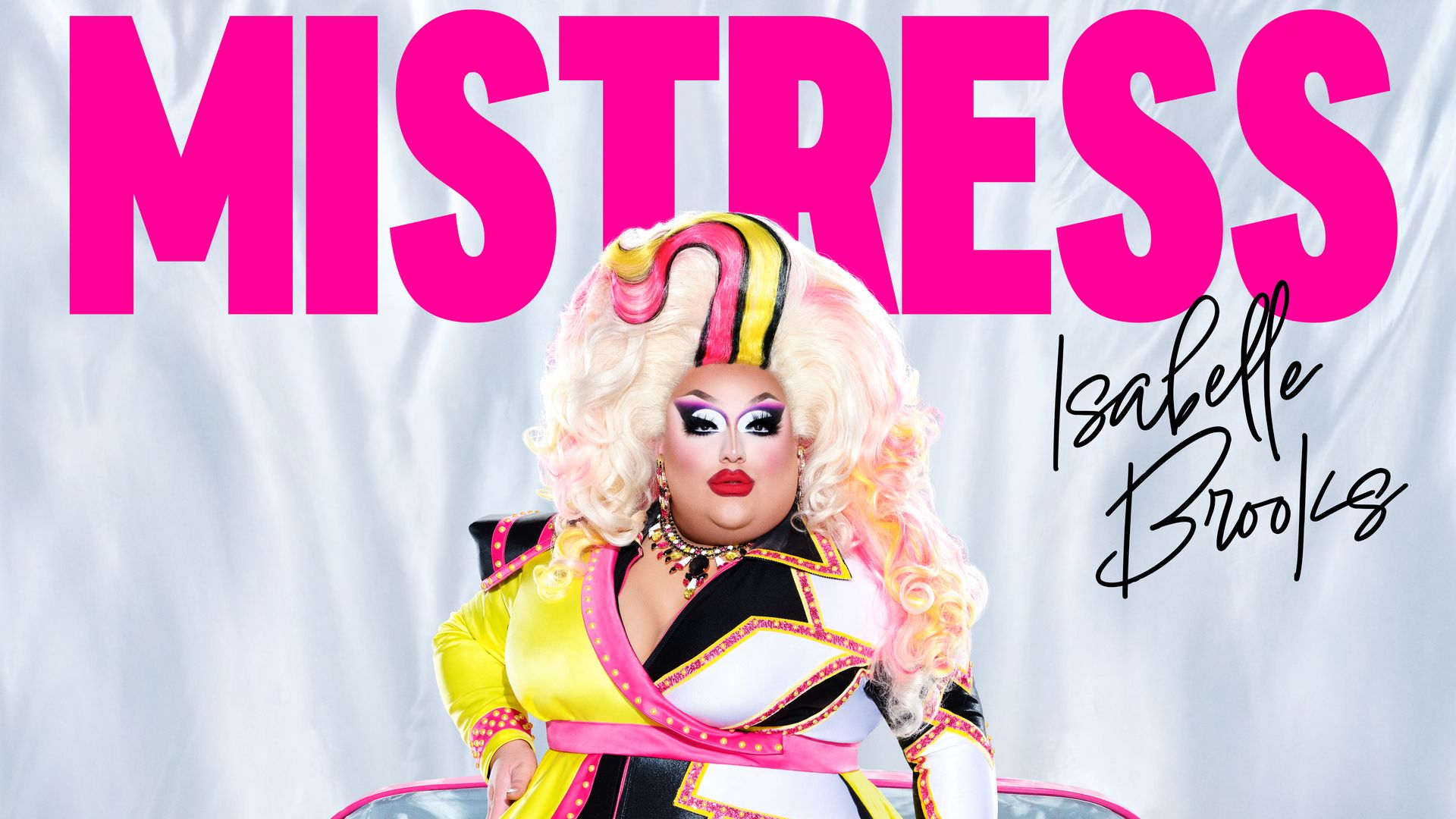 Photo of a drag queen named with the text "Mistress Isabelle Brooks"