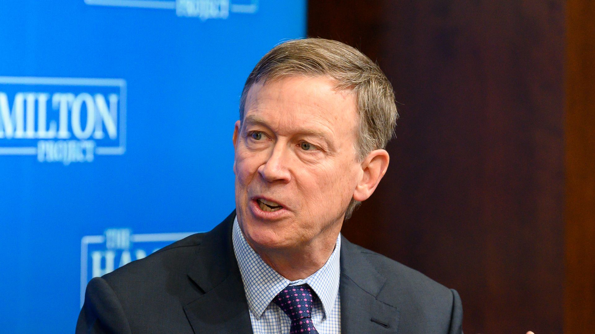 Photo of John Hickenlooper talking at a conference